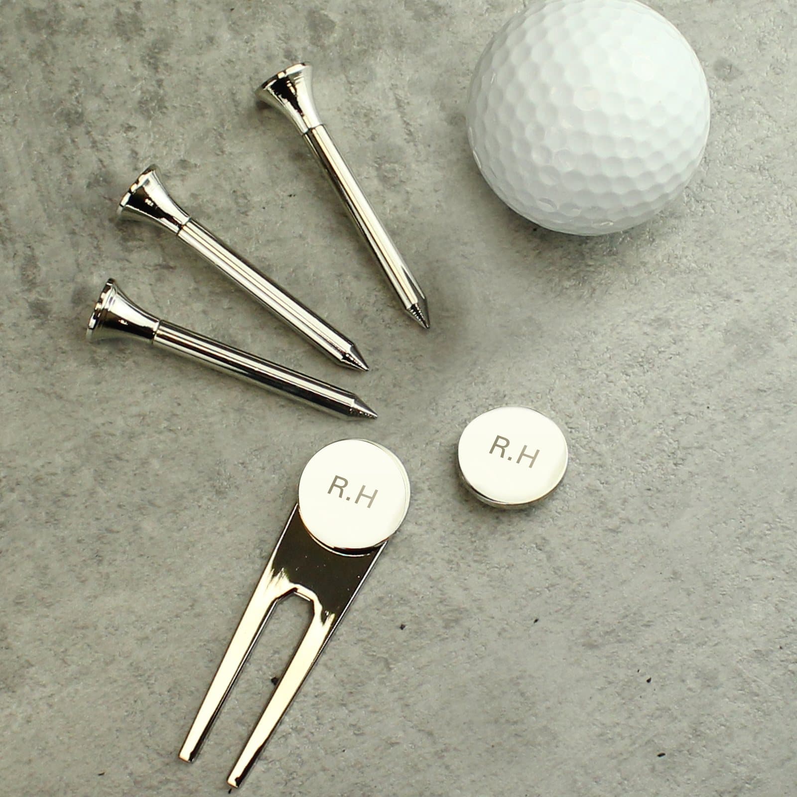 Silver plated golf set with tees, pitch repairer and ball markers