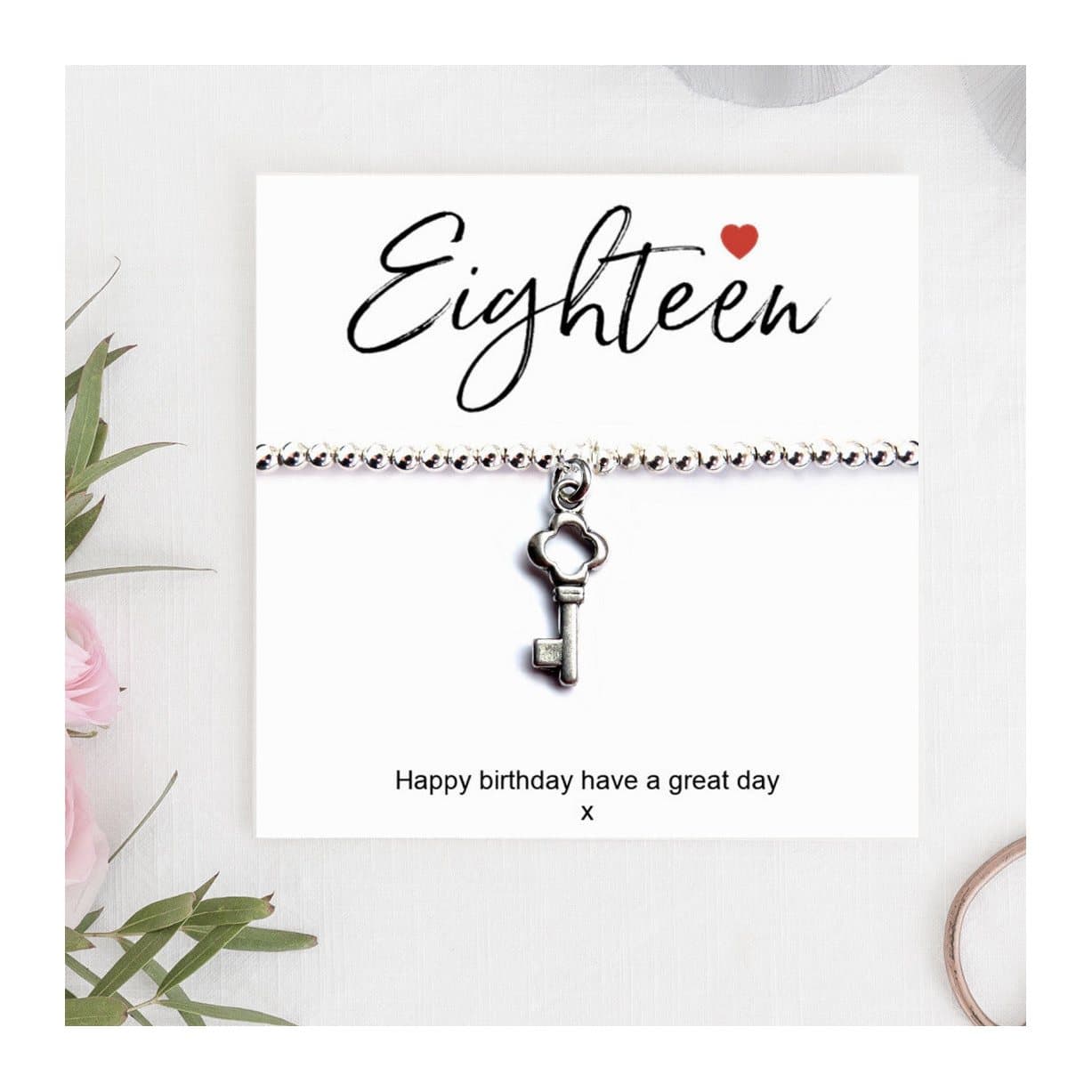 Silver stretch beaded bracelet, key charm and 18th birthday card