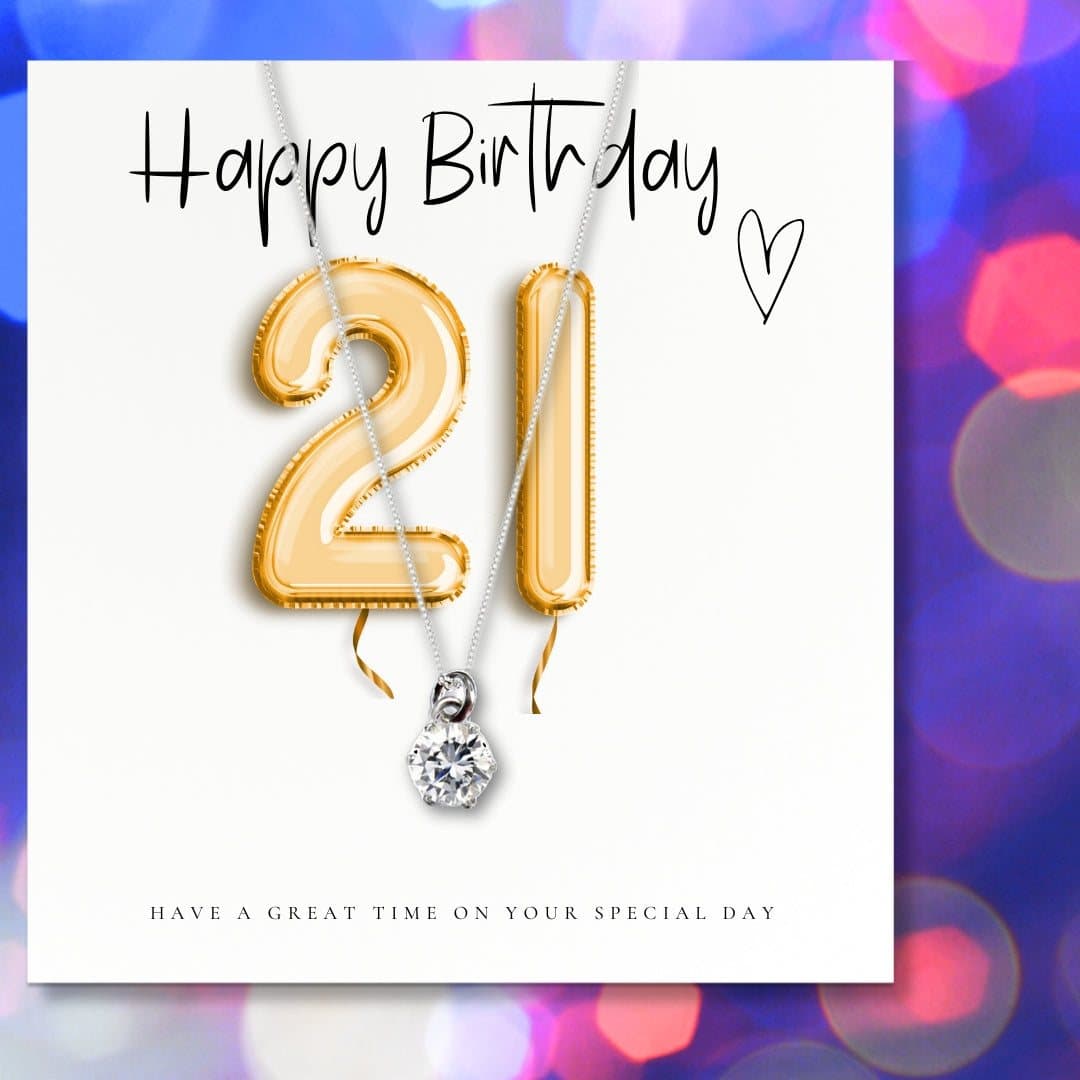 Silver necklace with a cubic zirconia charm and a gold balloons message card