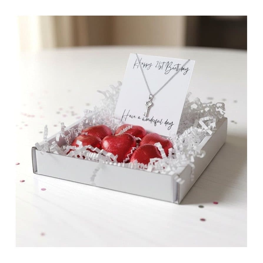 Key necklace on a 16 inch chain with six red foiled milk chocolate hearts