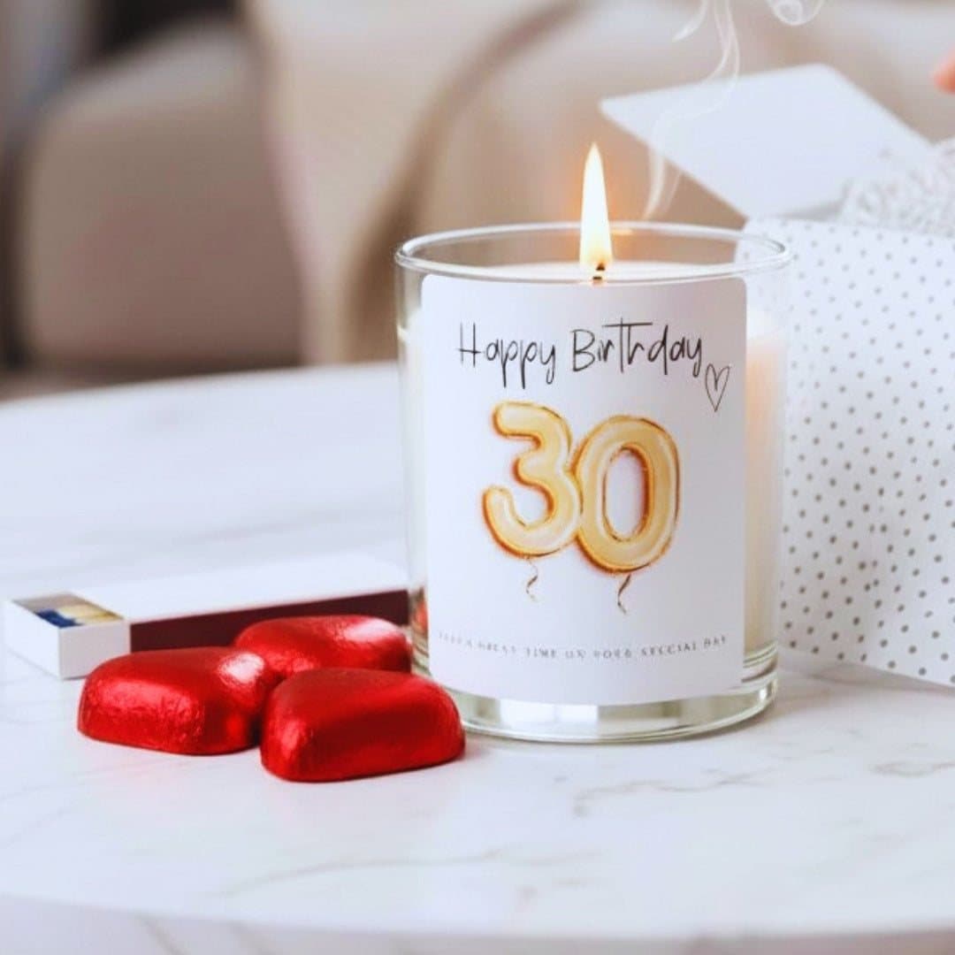 30th birthday candle with gold balloon design, red foil chocolate hearts and matches