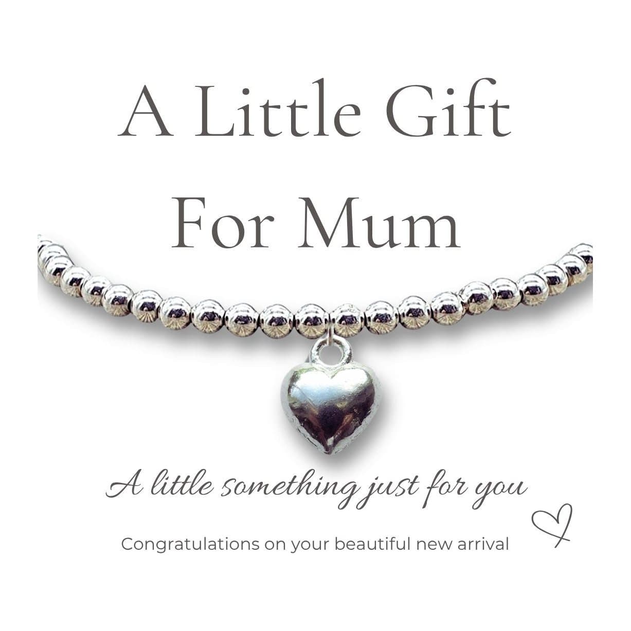 Silver plated puff heart charm on a stretch beaded bracelet