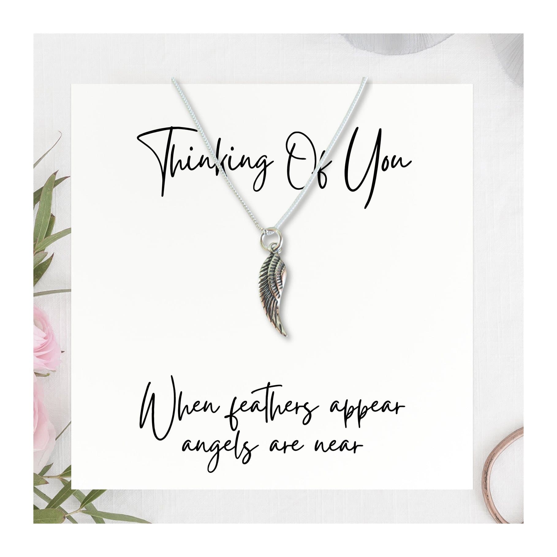 Sterling silver feather charm necklace with an angel wing charm on a chain
