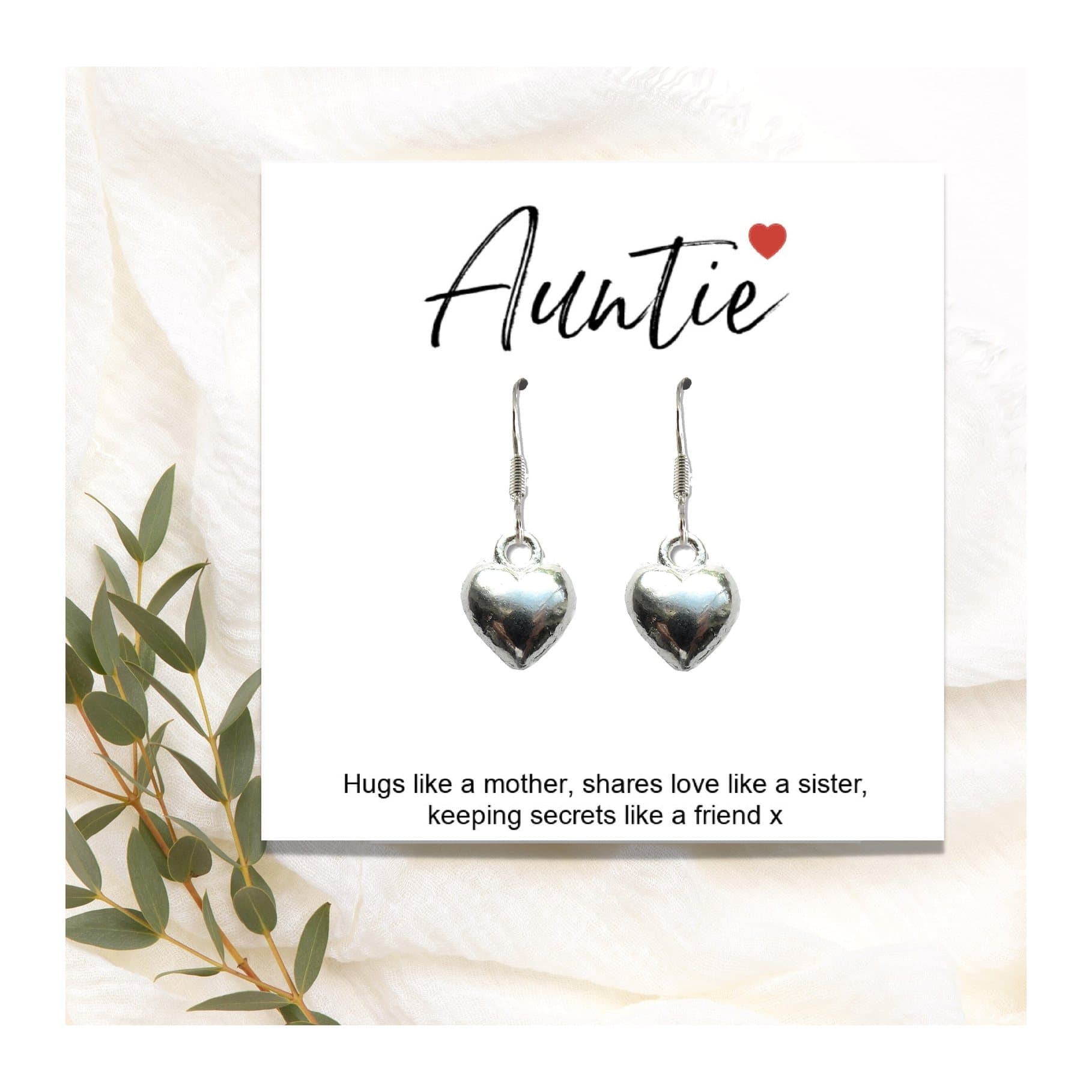 Heart earrings on a gift card with the words Auntie hugs like a mother