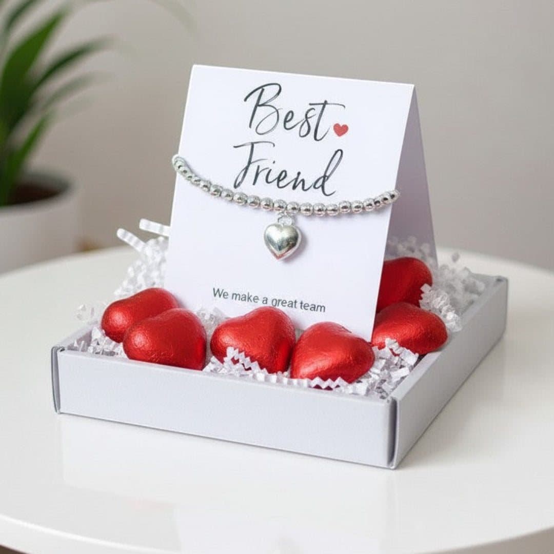 Silver heart bracelet, red foiled chocolate hearts and a message card