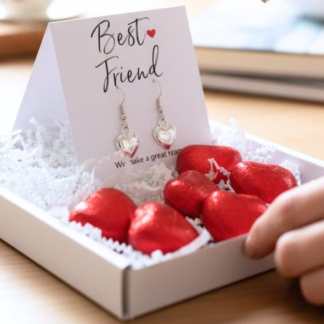 Silver heart earrings and red foiled milk chocolate hearts in a best friend gift hamper