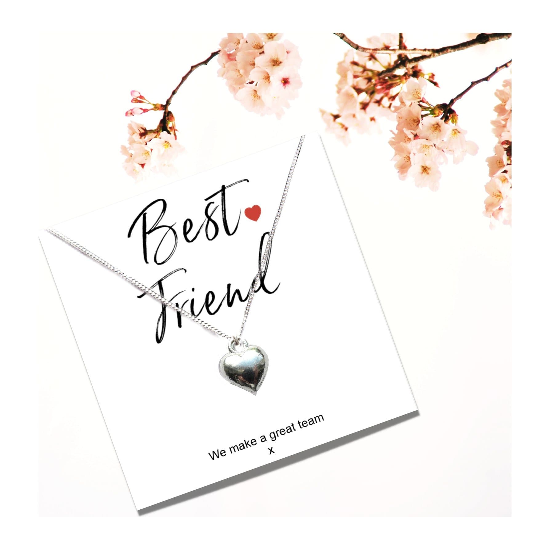 Silver heart charm necklace presented on a gift card