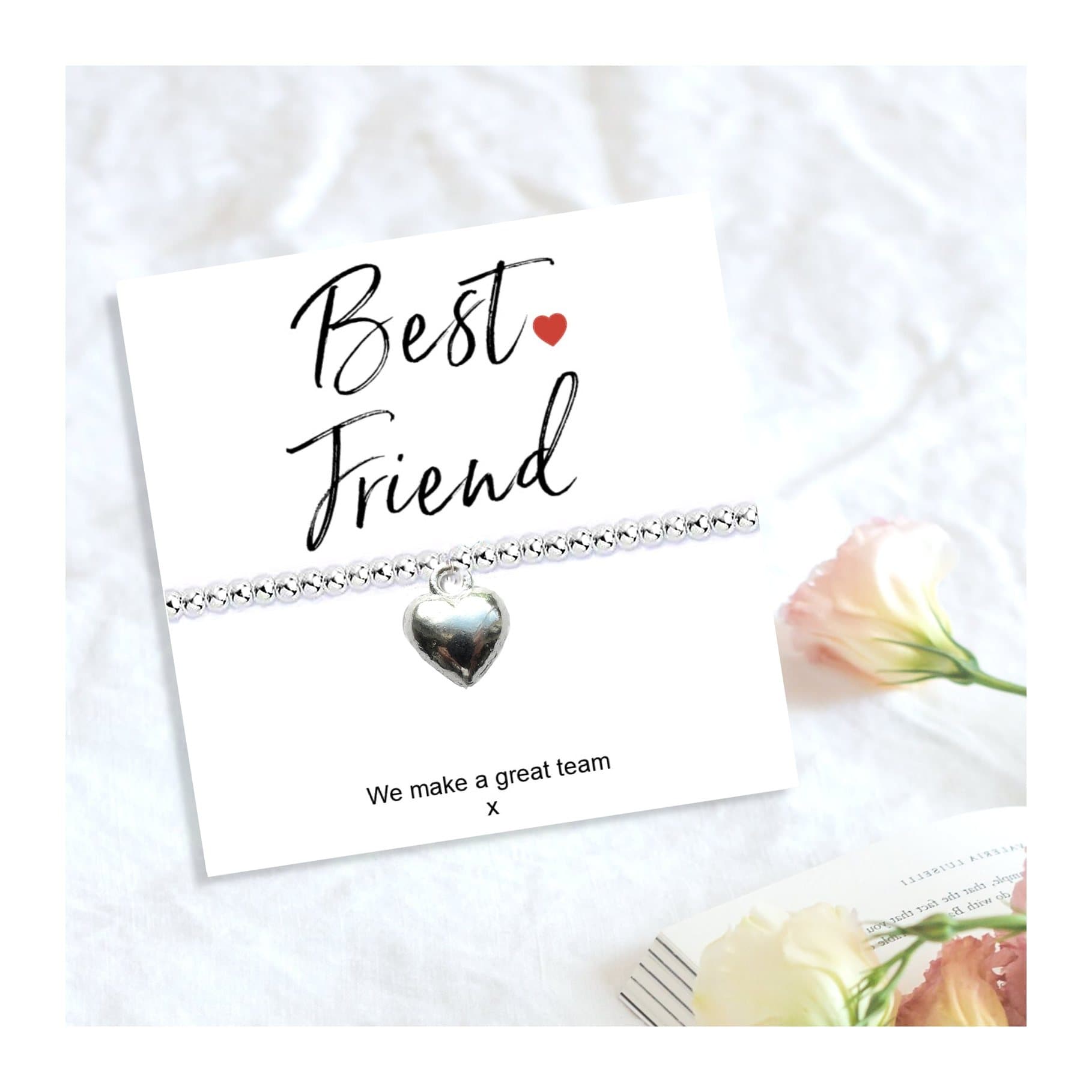 Silver heart charm stretch beaded bracelet presented on a Best Friend message card