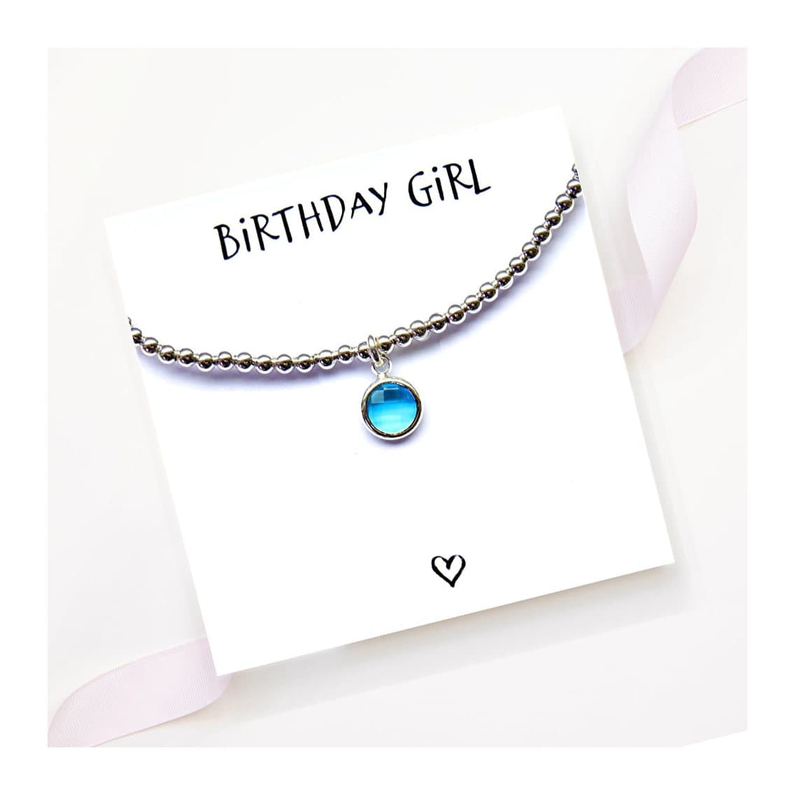 Birthstone charm bracelet with an 8mm coloured glass charm in a silver plated mount