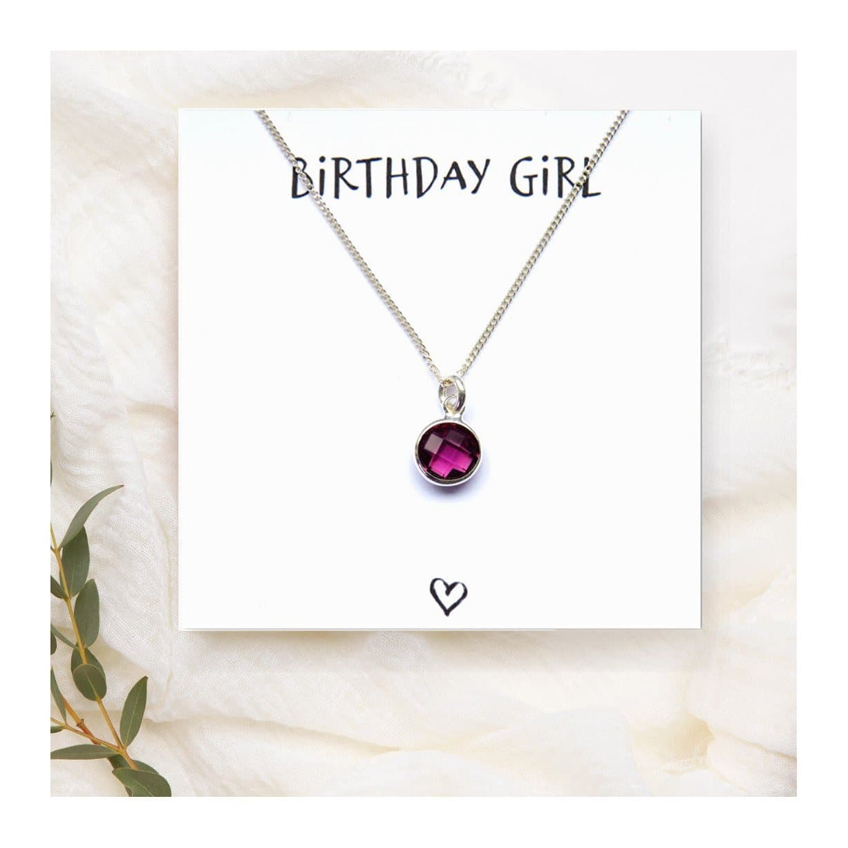 Birthstone charm necklace on a sterling silver chain with a message card