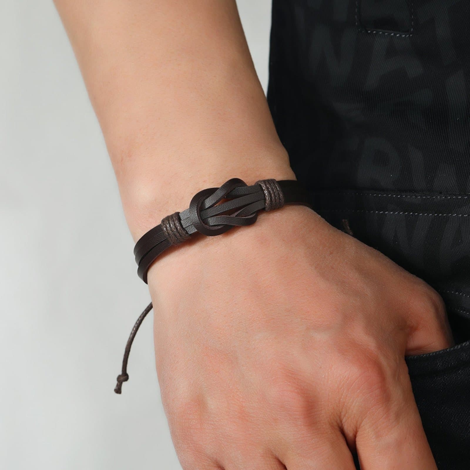 Black leather knot bracelet for men with an adjustable wax rope