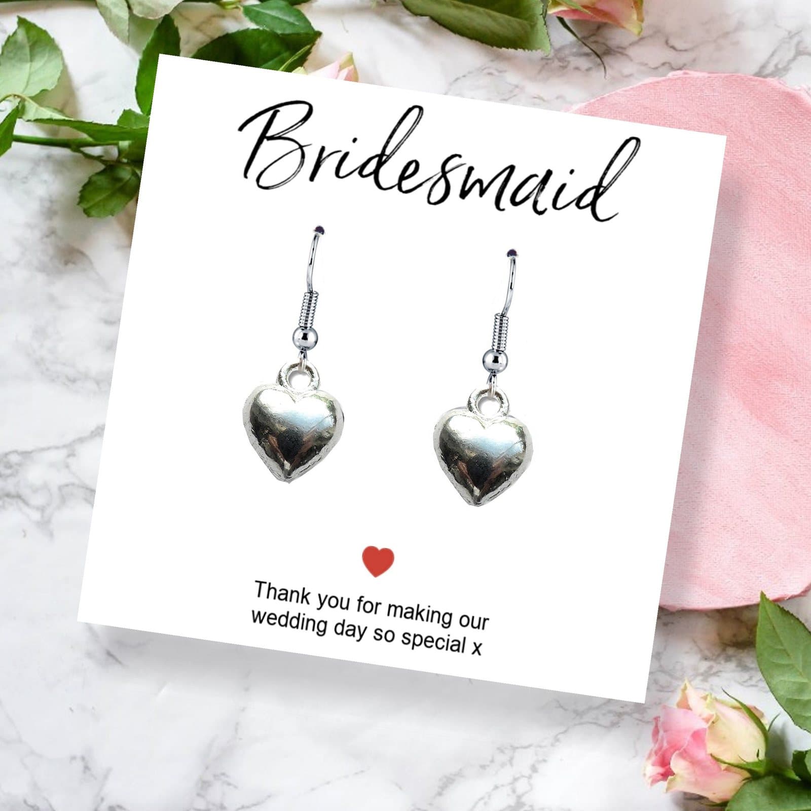 Silver plated heart earrings presented on a thank you card for bridesmaids