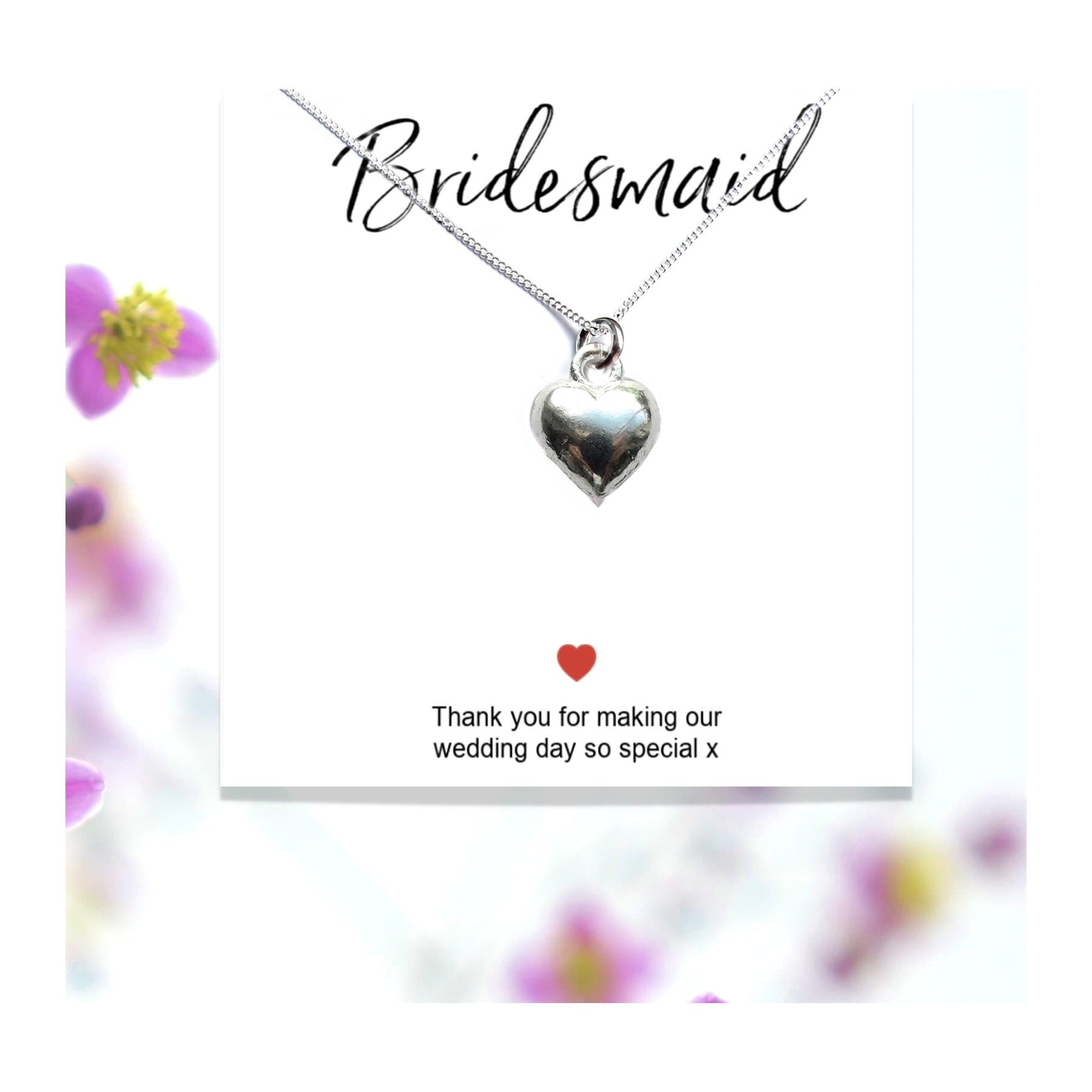 Silver-plated heart necklace on a thank you gift card for bridesmaids