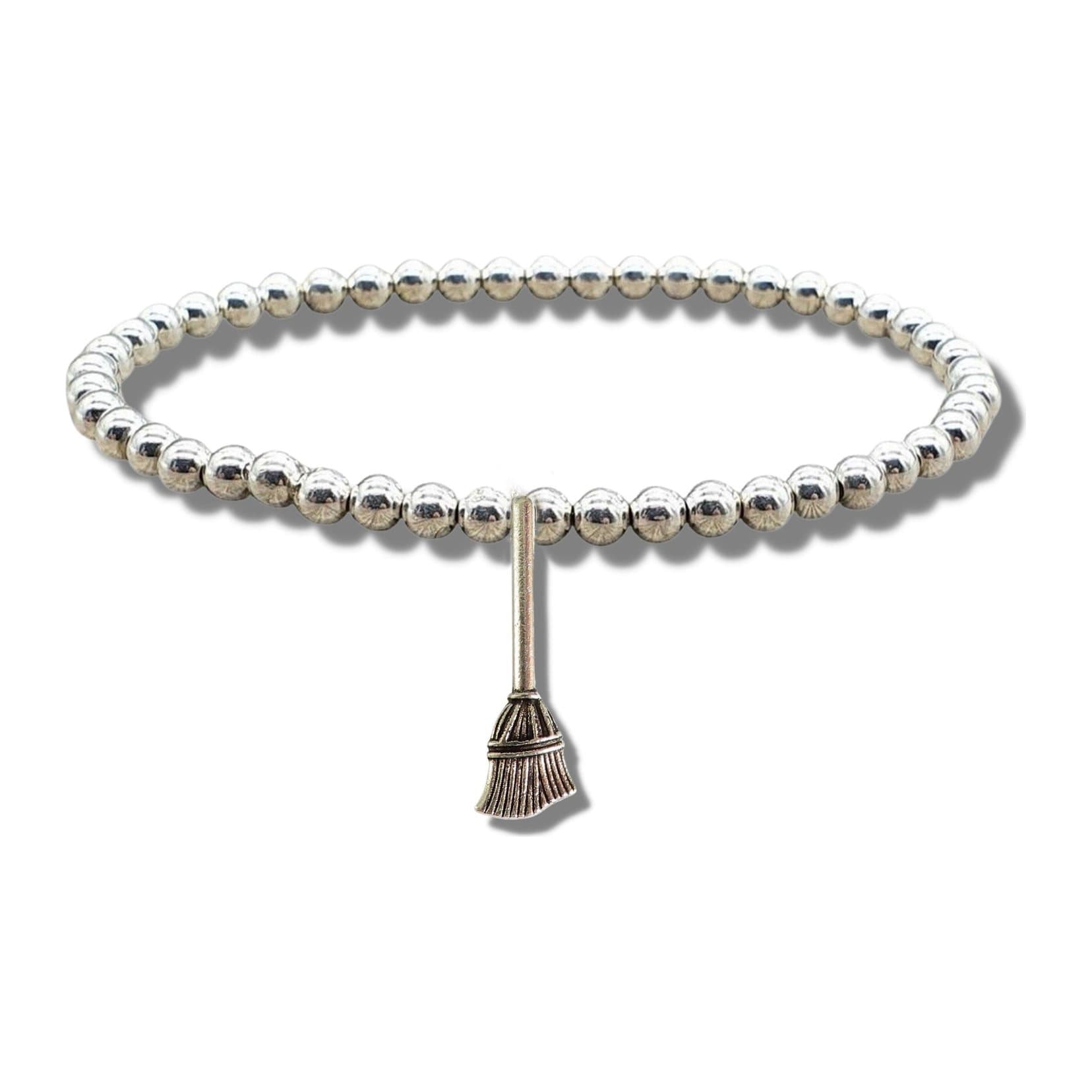 Silver beaded stretch bracelet with a broom charm