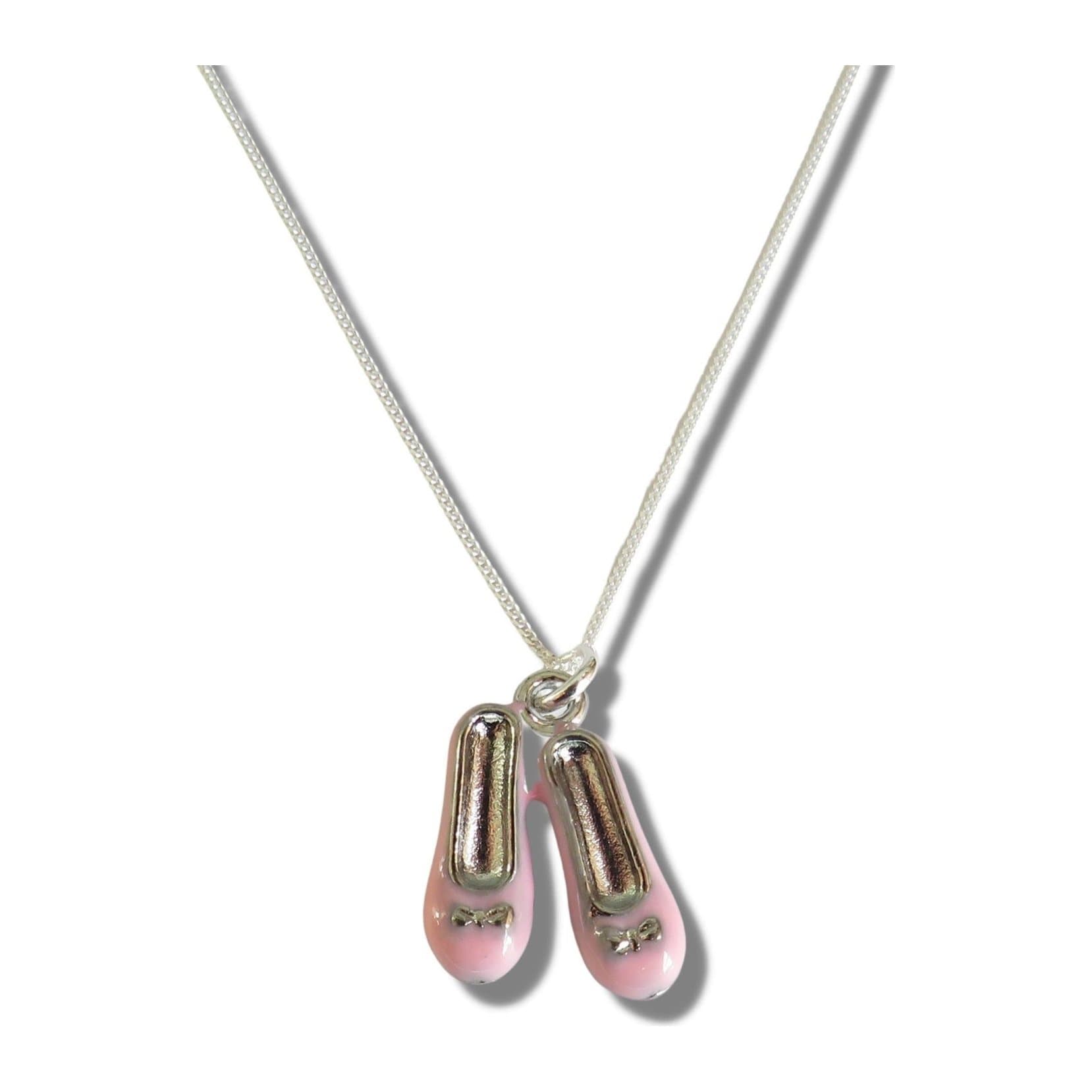 Child's silver necklace with a ballet shoes charm on a chain