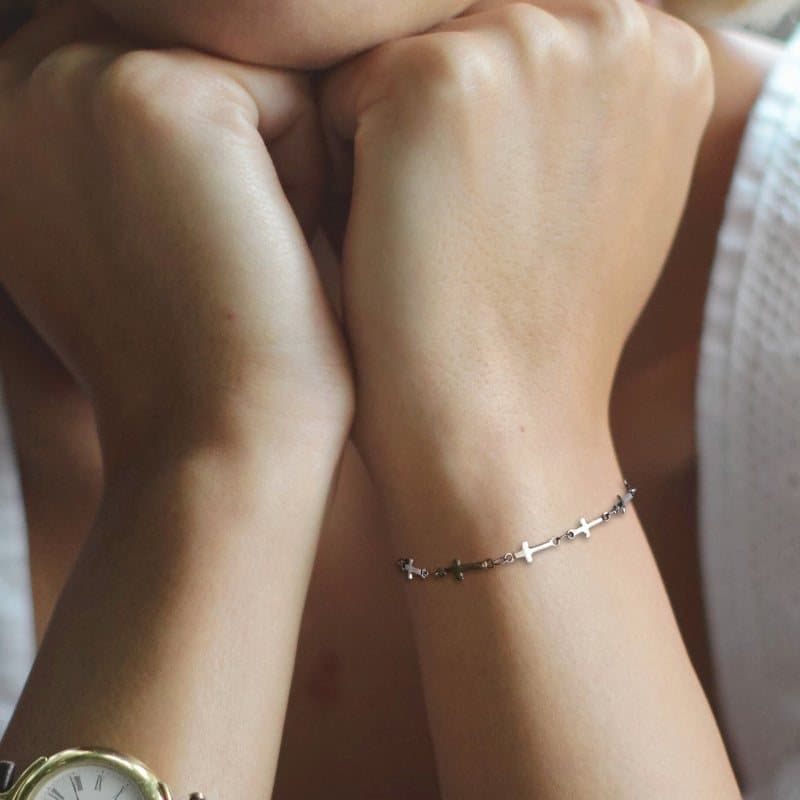Silver cross chain bracelet with a small cross design