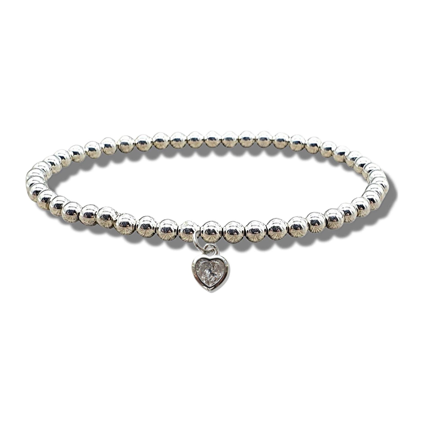 Stretch beaded bracelet with a silver mini cubic zirconia heart charm