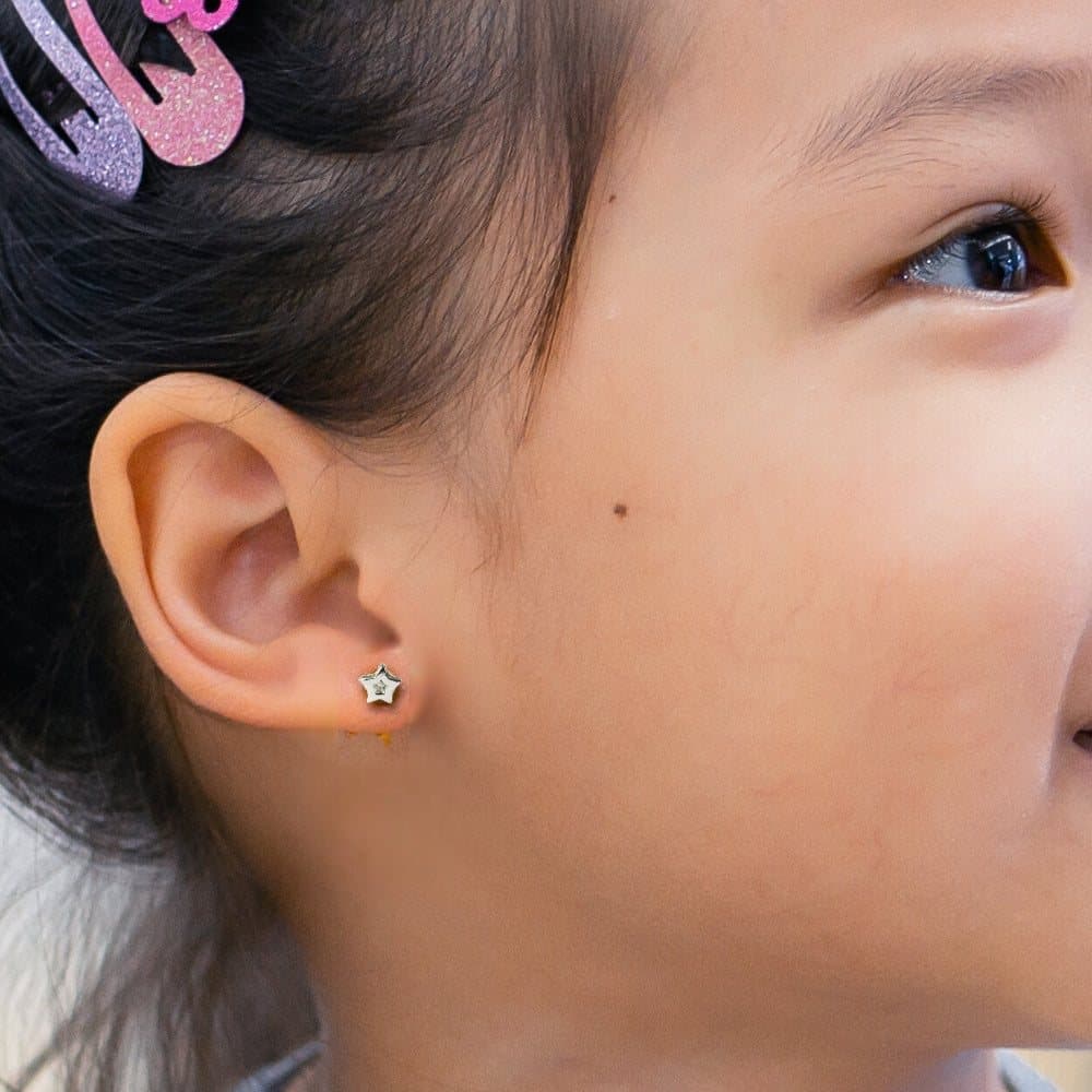 Dinky star stud earrings with a diamanté in the centre of the star