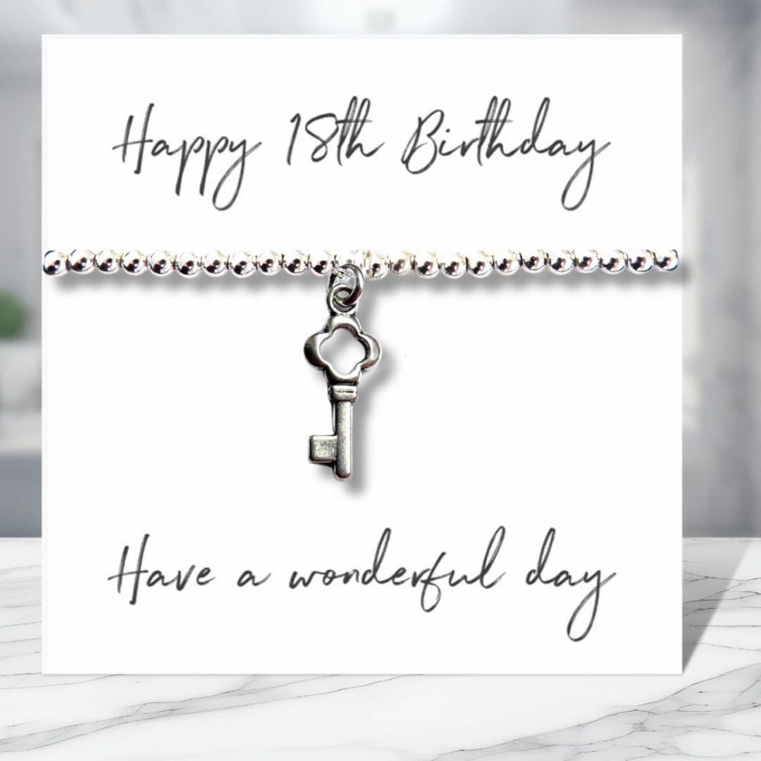 18th birthday charm bracelet with a silver key charm