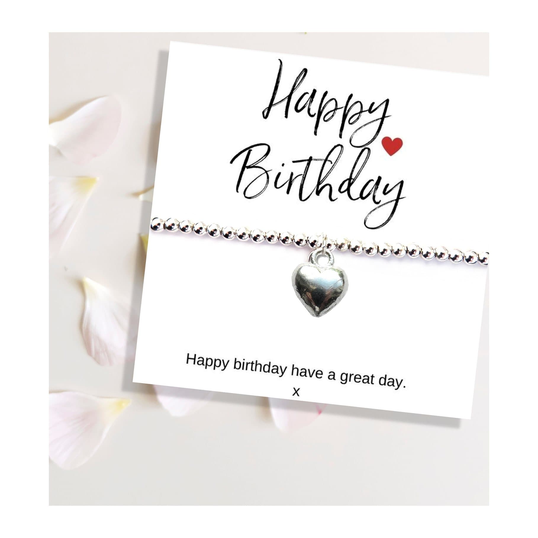 Silver beaded heart charm bracelet presented on a Happy Birthday gift card