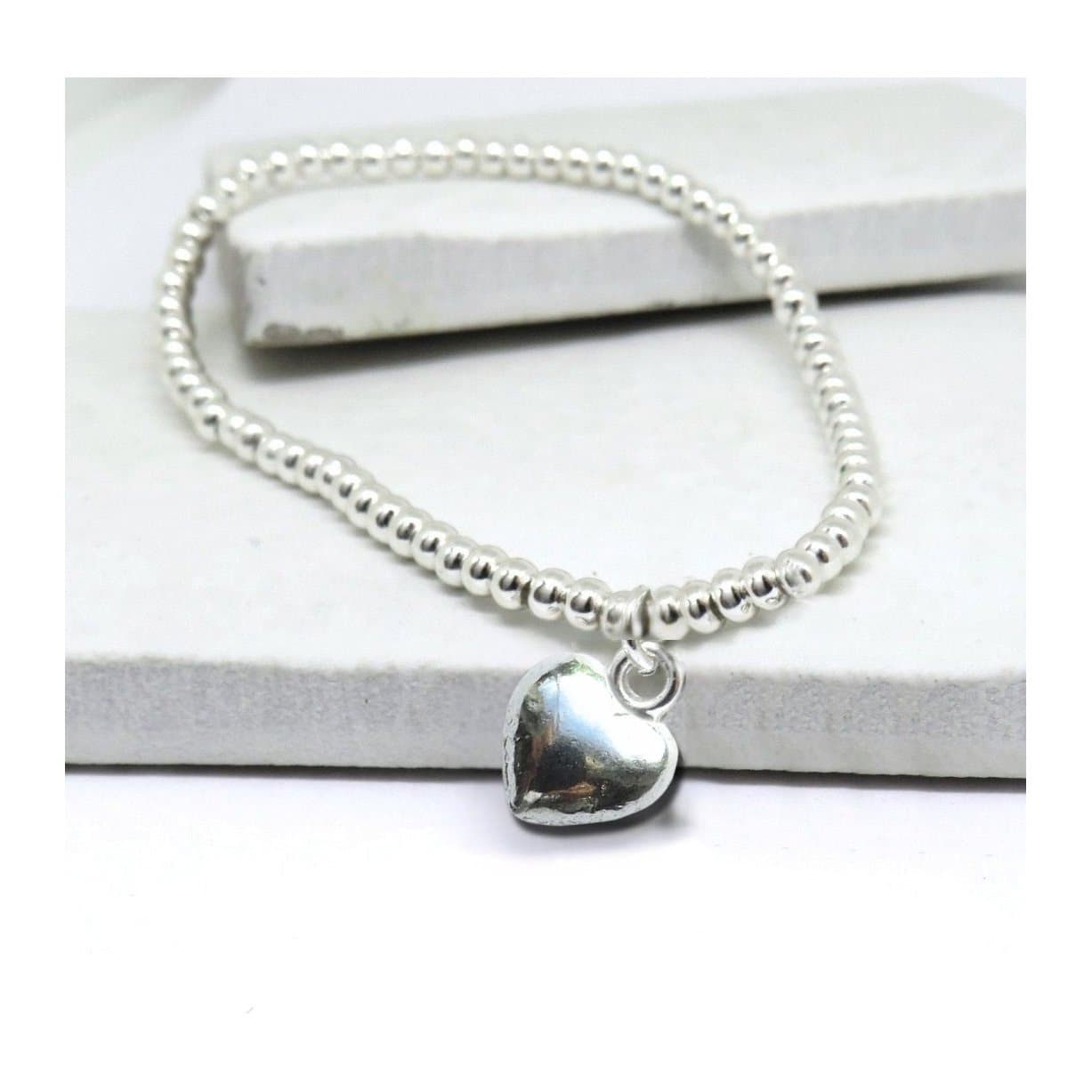Happy Birthday gift box with a silver beaded heart bracelet and chocolate hearts