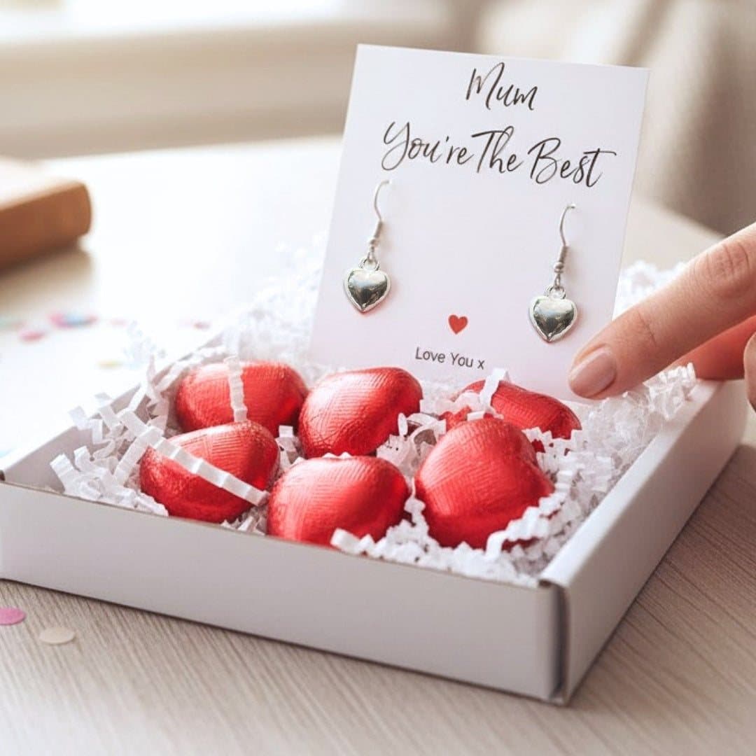 Mini birthday hamper with silver heart earrings, milk chocolate hearts and a message card
