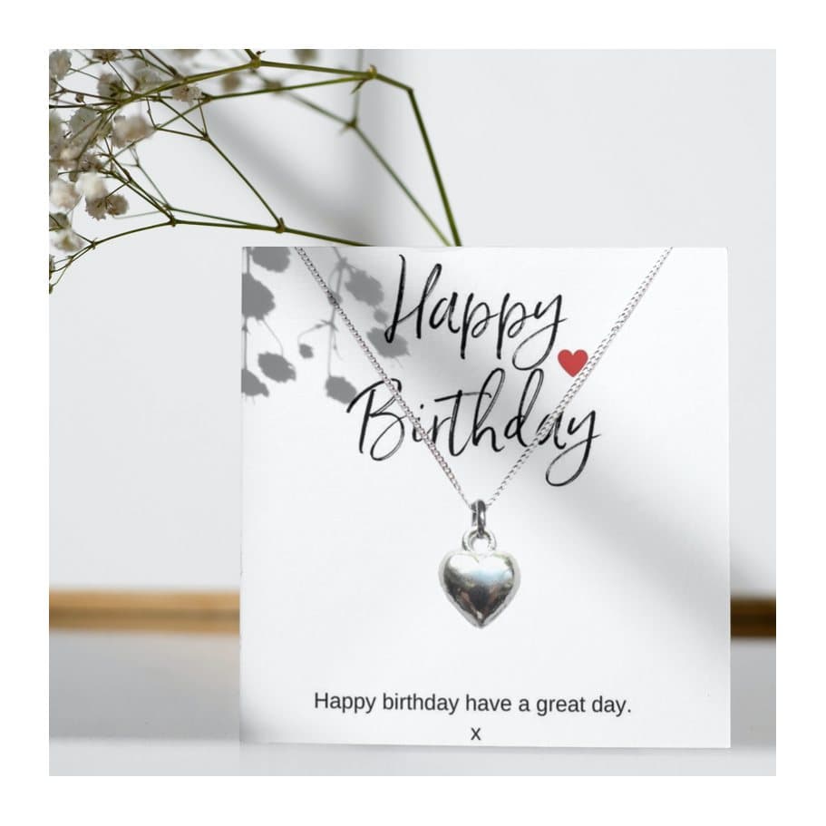 Silver heart charm necklace presented on a Happy Birthday message card.