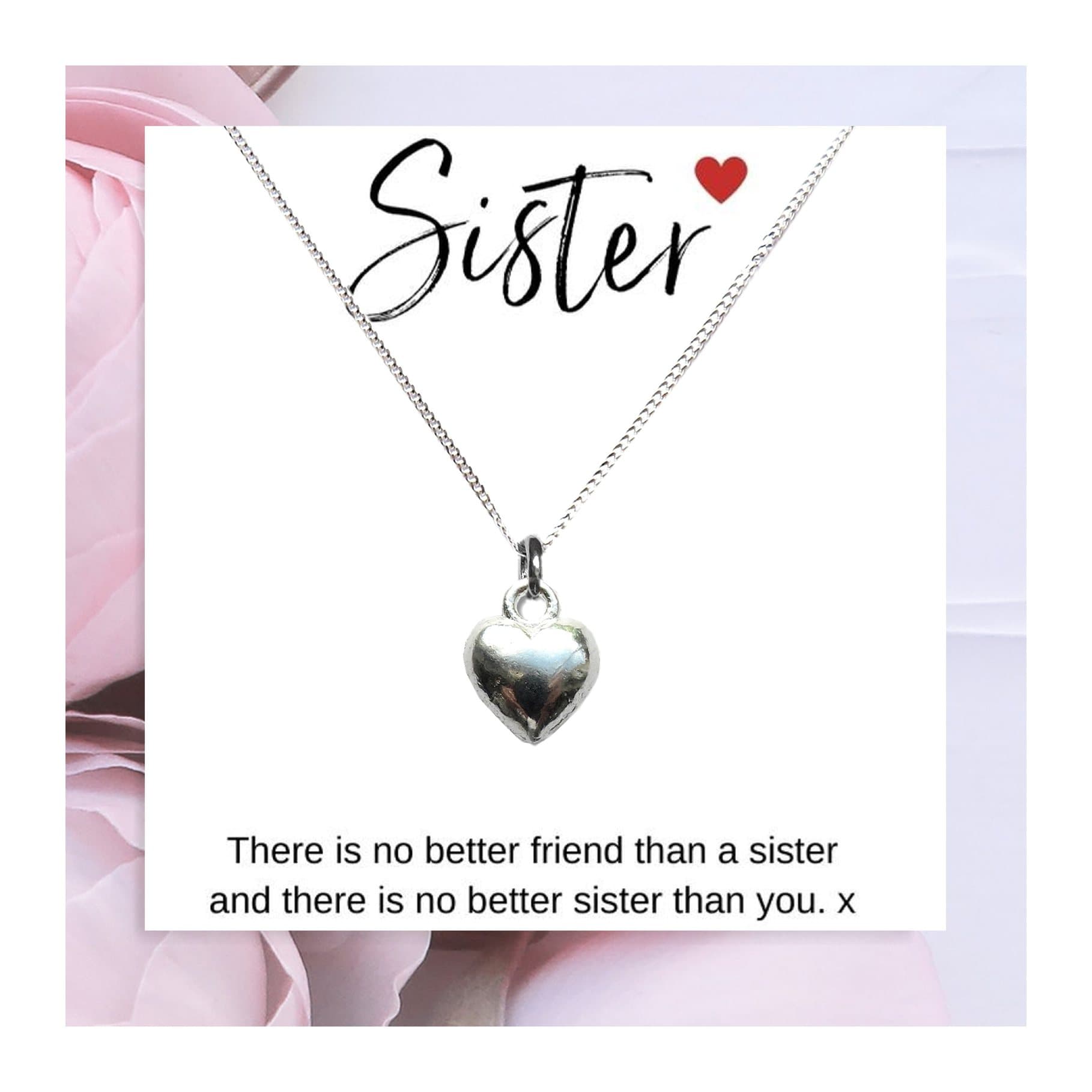 Heart charm necklace presented on a sister quote gift card
