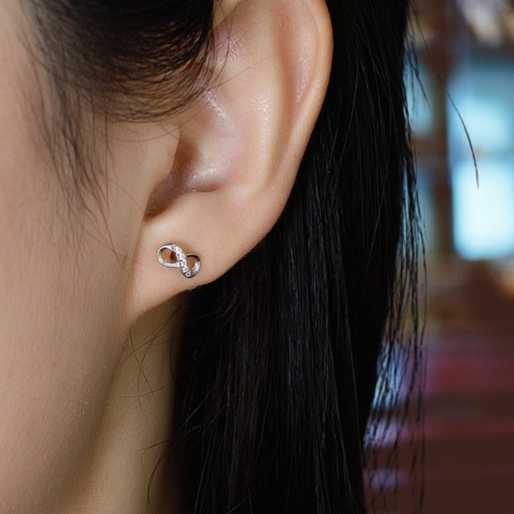 Sterling silver infinity stud earrings with a diamante sparkle