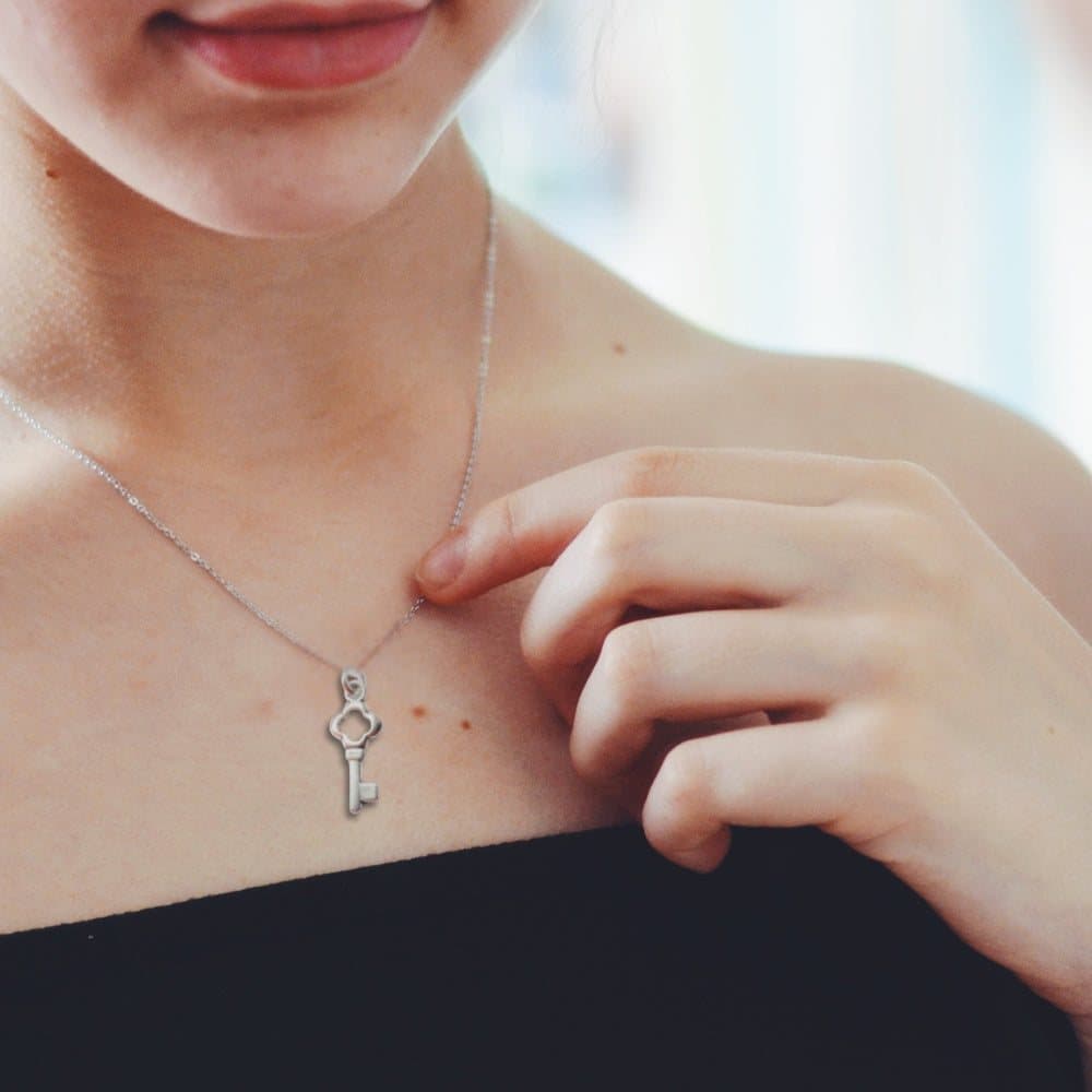 Silver key charm necklace on a sterling silver chain