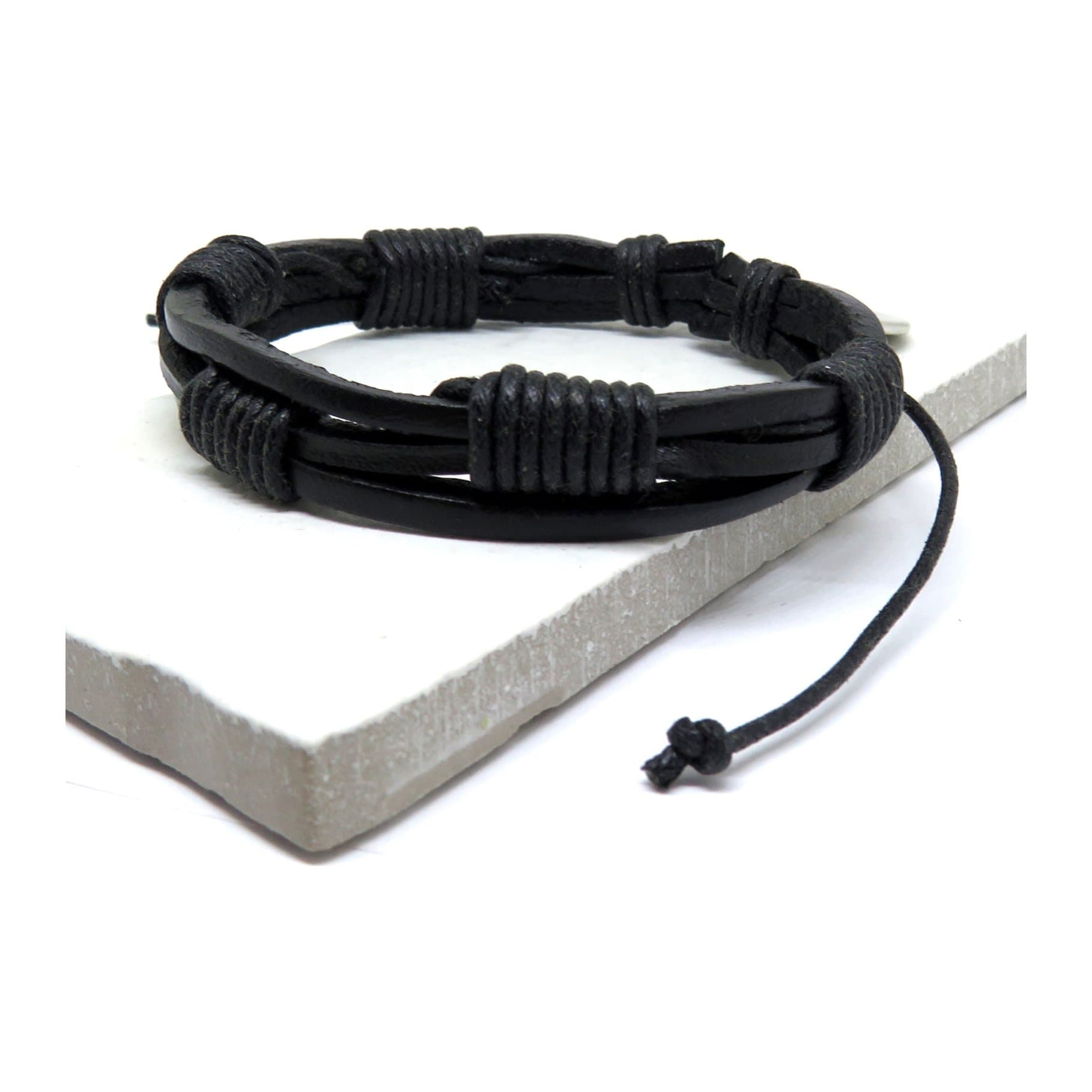 Men's black multi-strand leather and cord bracelet with an adjustable cord