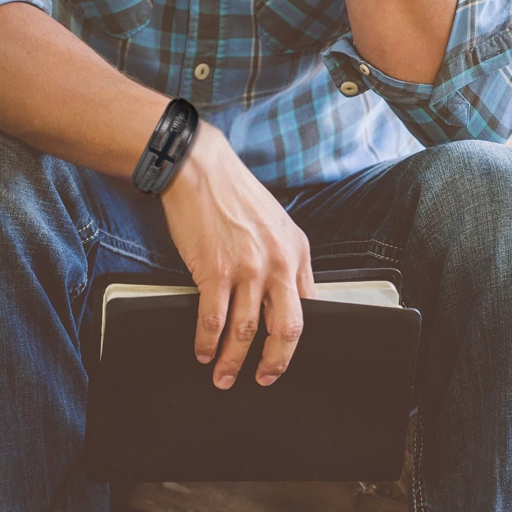 Men's black faux leather bracelet with a sleek cross design