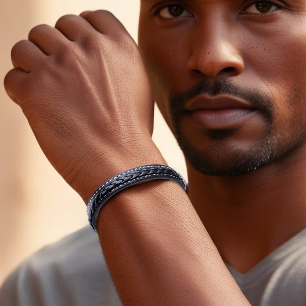 Men's black leather bracelet with white stitching and a silver magnetic fastening