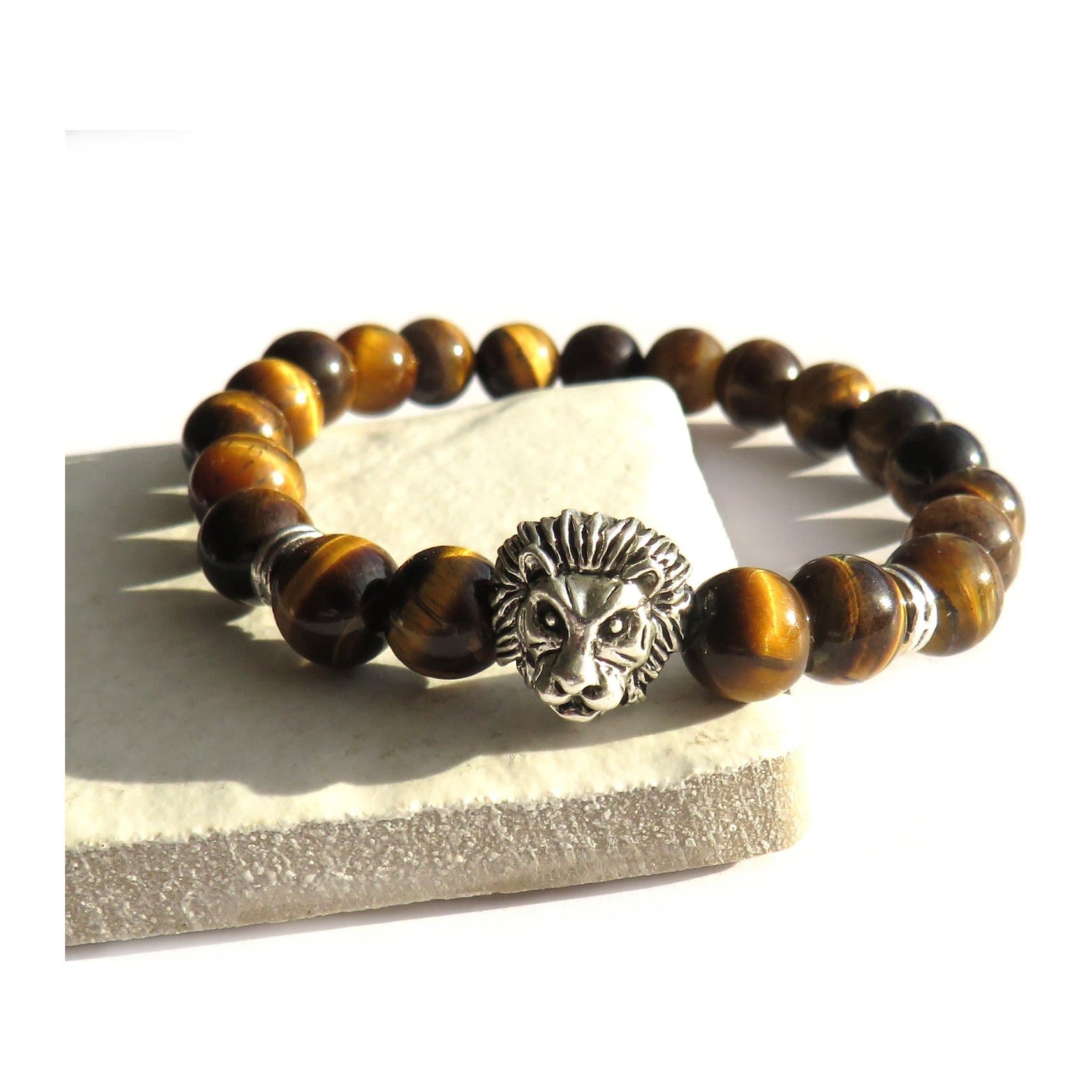 Men's tiger eye bracelet with a lion head charm and polished beads