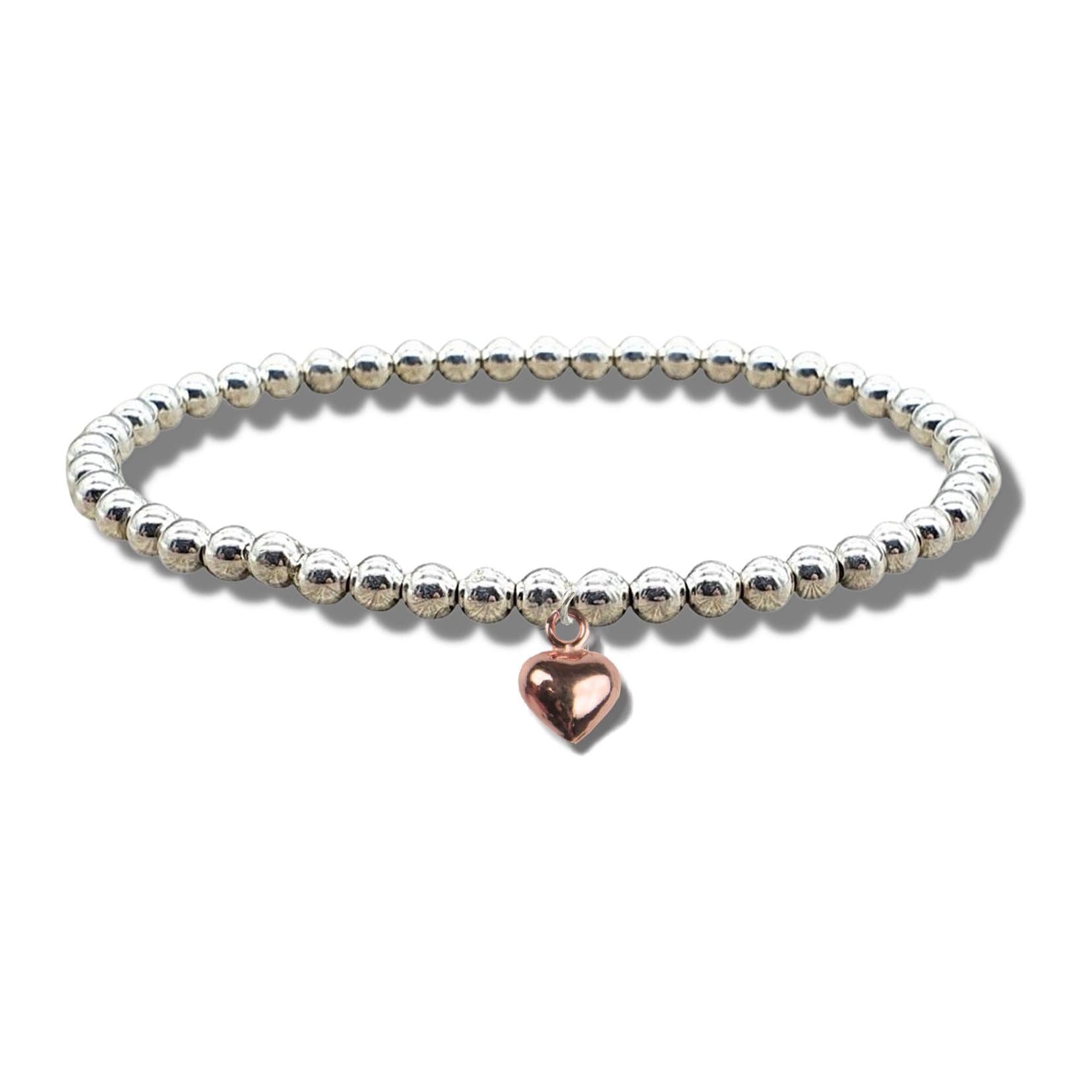 Gold plated mini puff heart charm on a stretch bracelet of silver plated beads