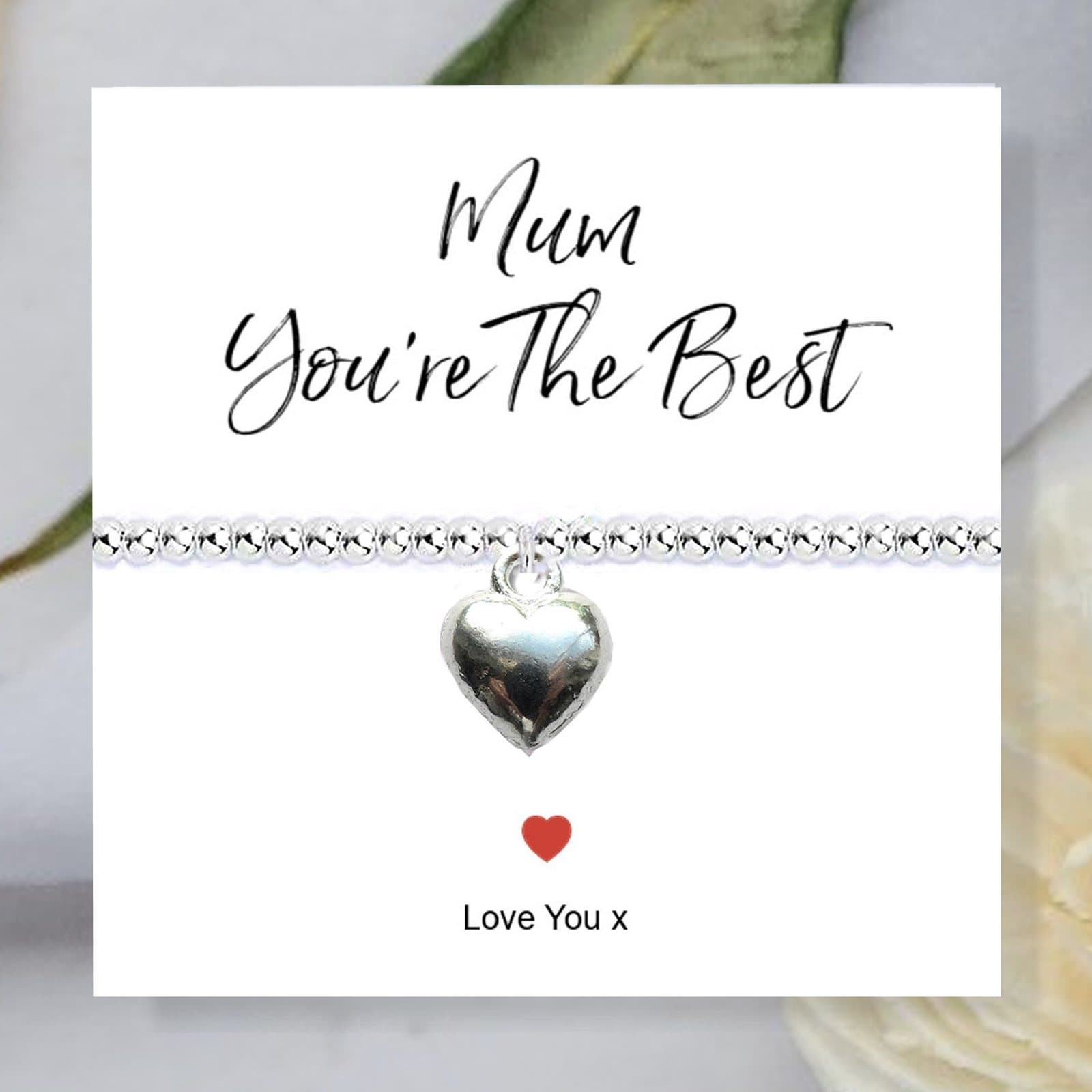 Silver beaded bracelet with a heart charm on a card reading Mum You're The Best