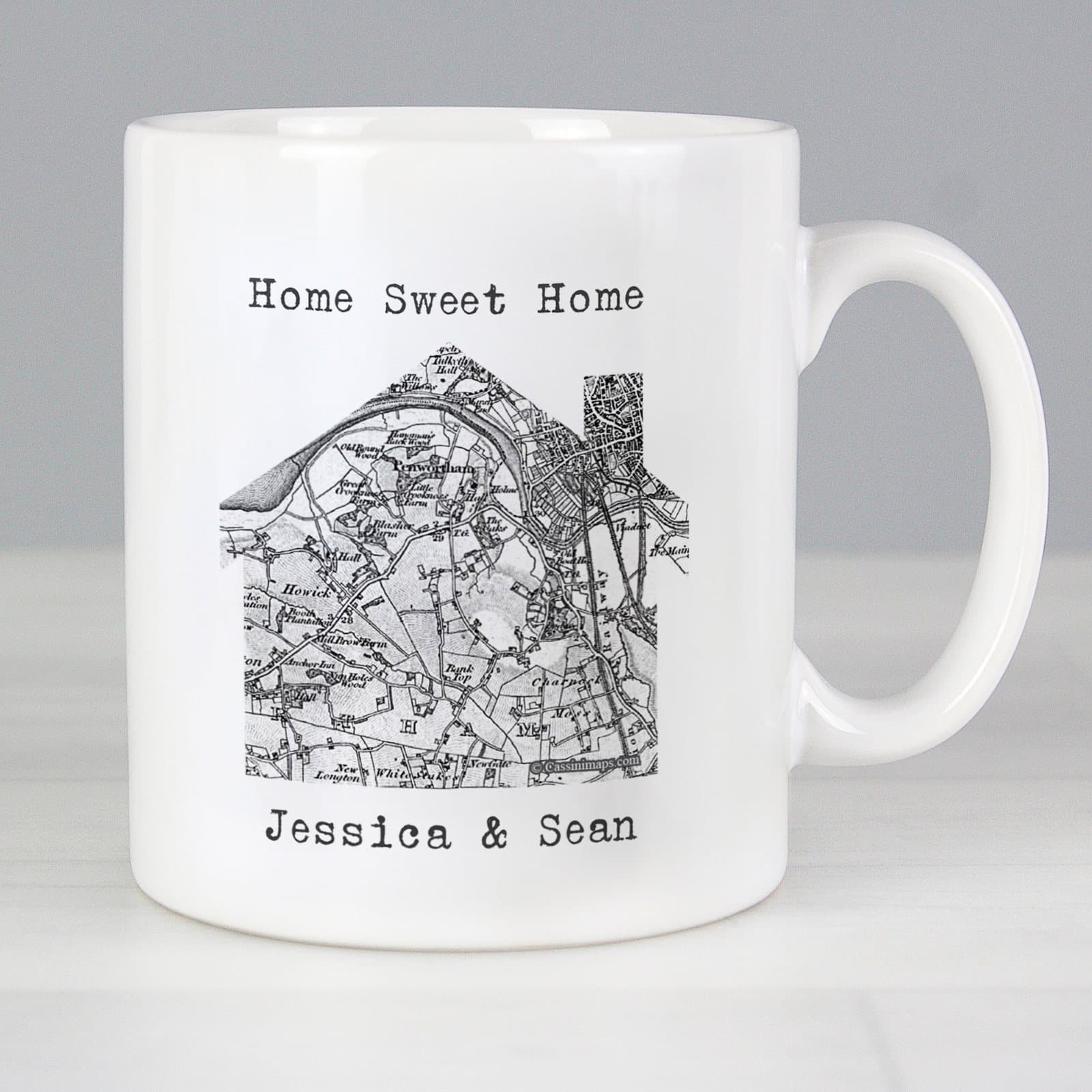 Ceramic mug showing an old map with a house and personalised text