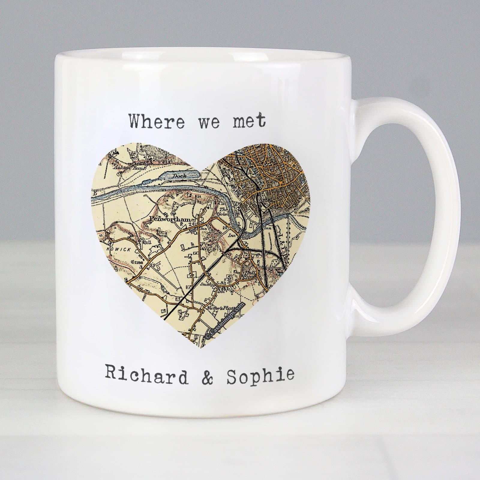 Ceramic mug showing an old map with a heart and personalised text