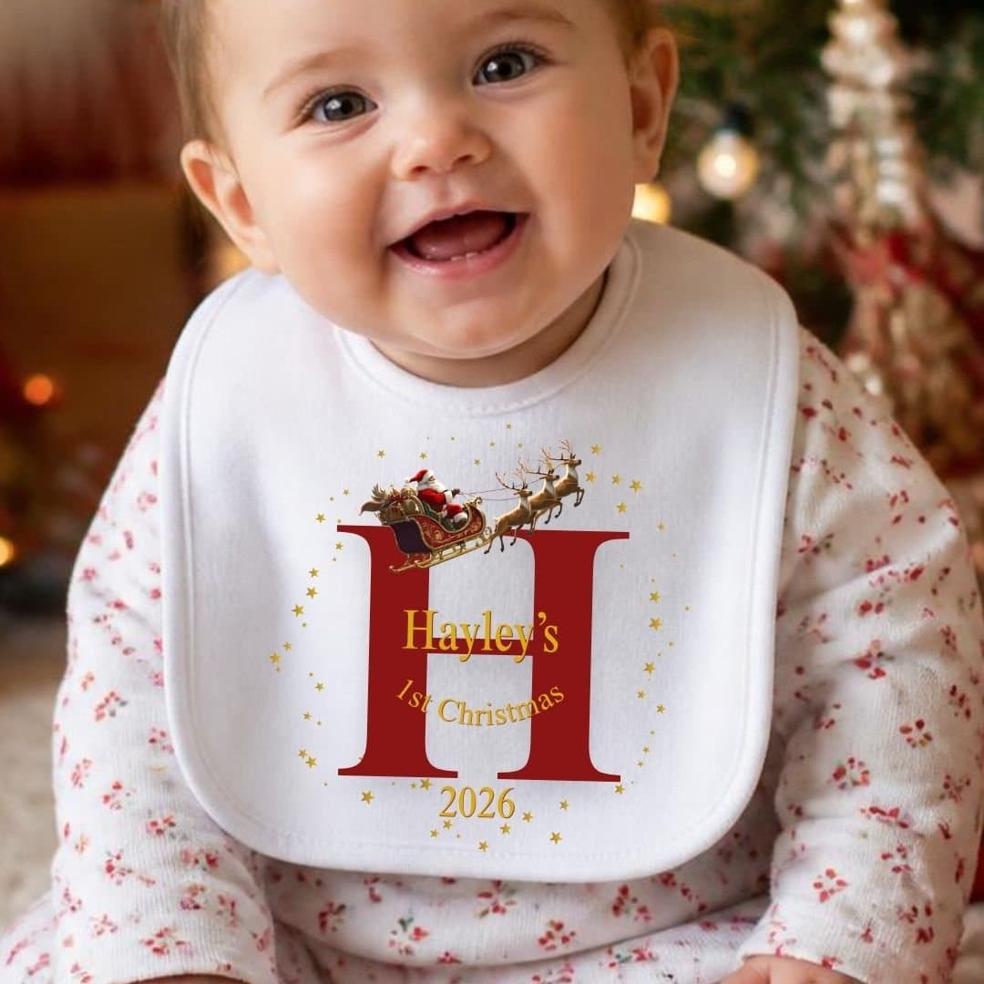 Baby vest printed with Santa on his sleigh and reindeer
