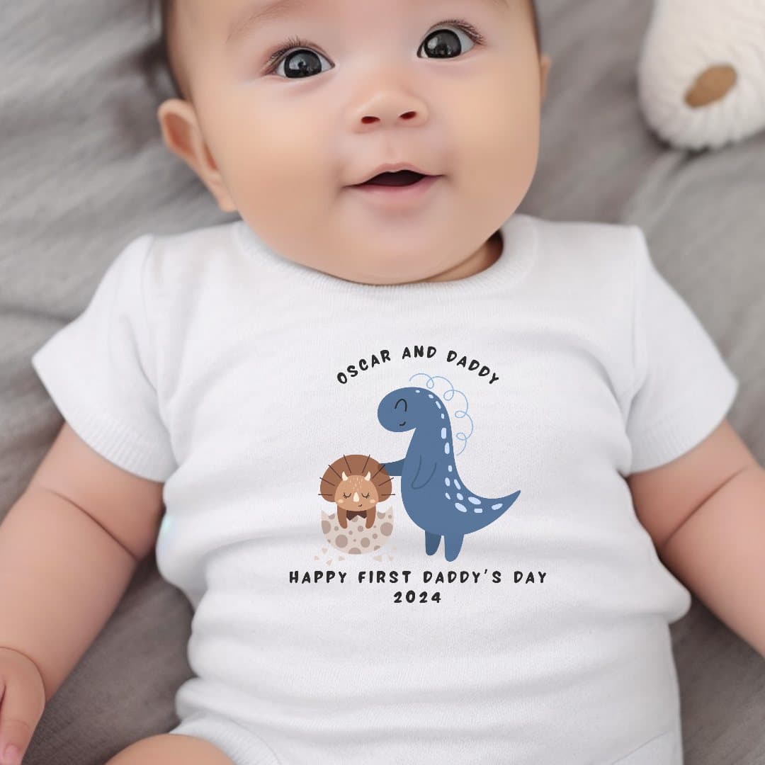 Dinosaur babygrow with a 'Happy First Daddy's Day 2026' design