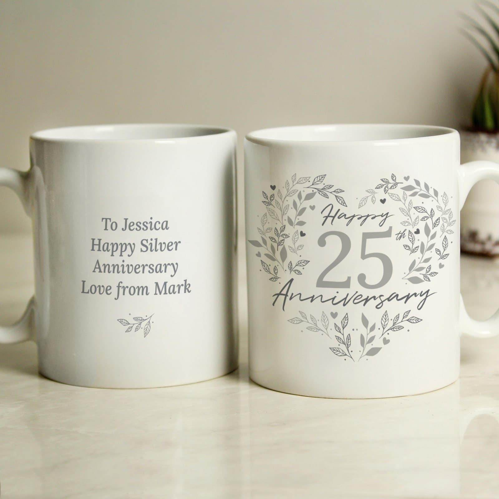 Ceramic mug with a 25th Anniversary design on the front