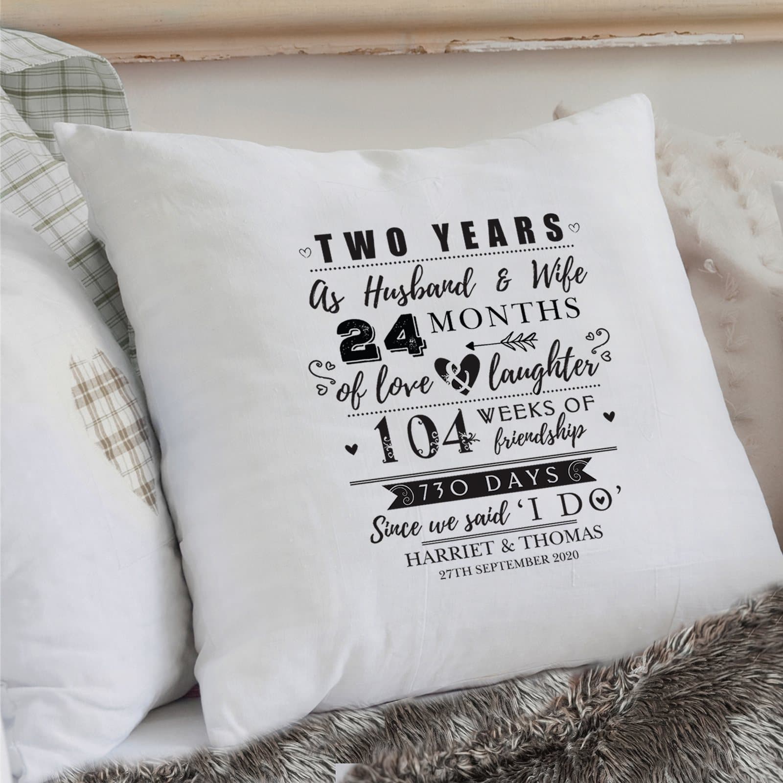 Cushion with Two Years Married wording and two personalised lines at the bottom