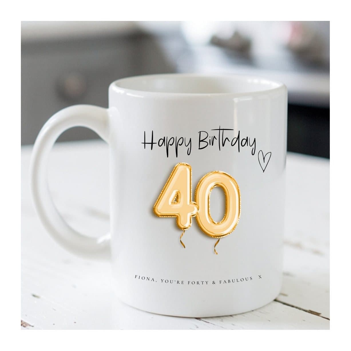 Ceramic mug with a 40th birthday design of gold balloons