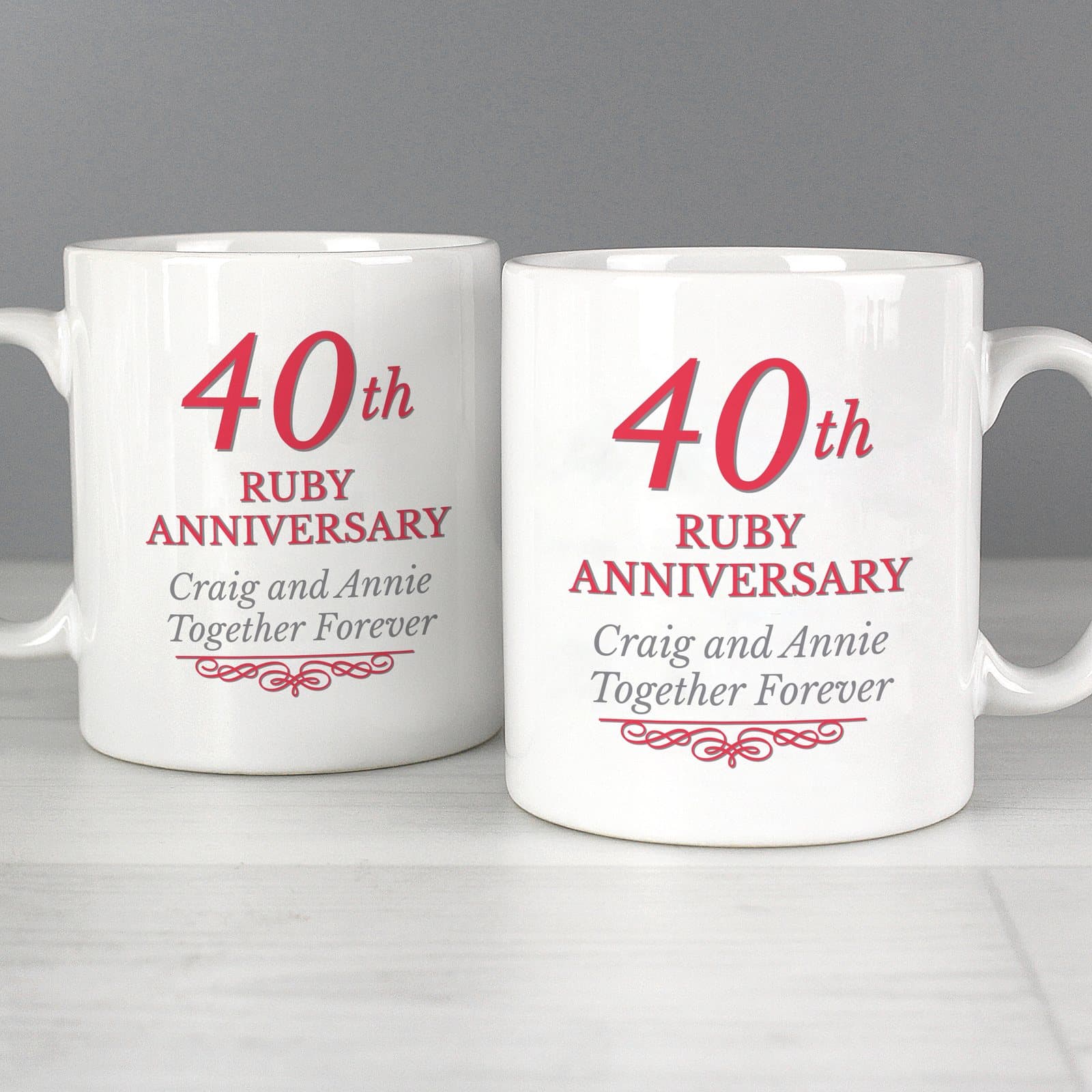 Pair of ceramic mugs with 40th Ruby Anniversary text on the front