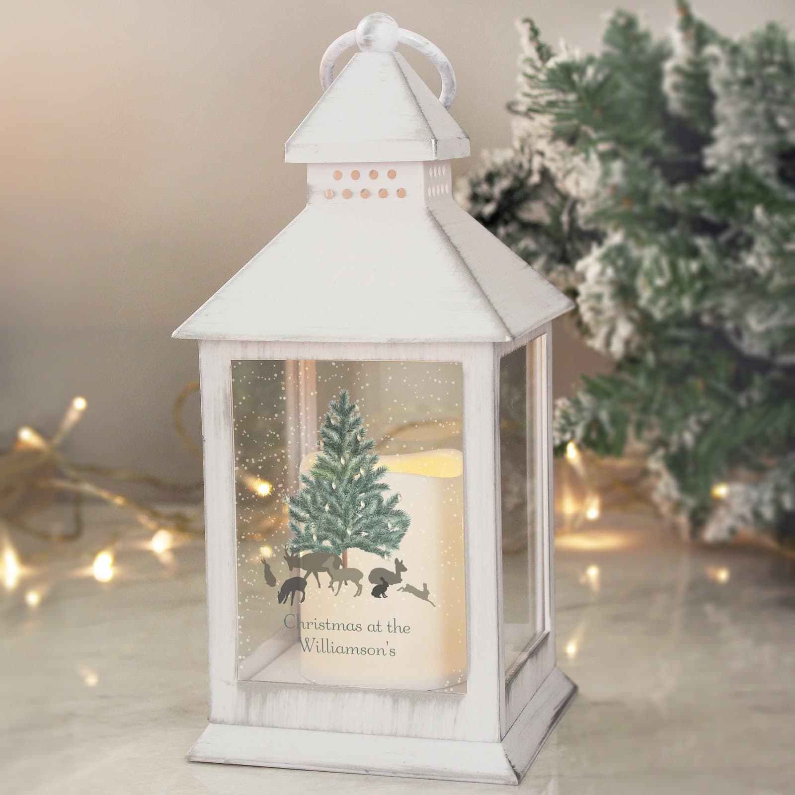 White light up lantern with a hoop and a warm orange flame effect