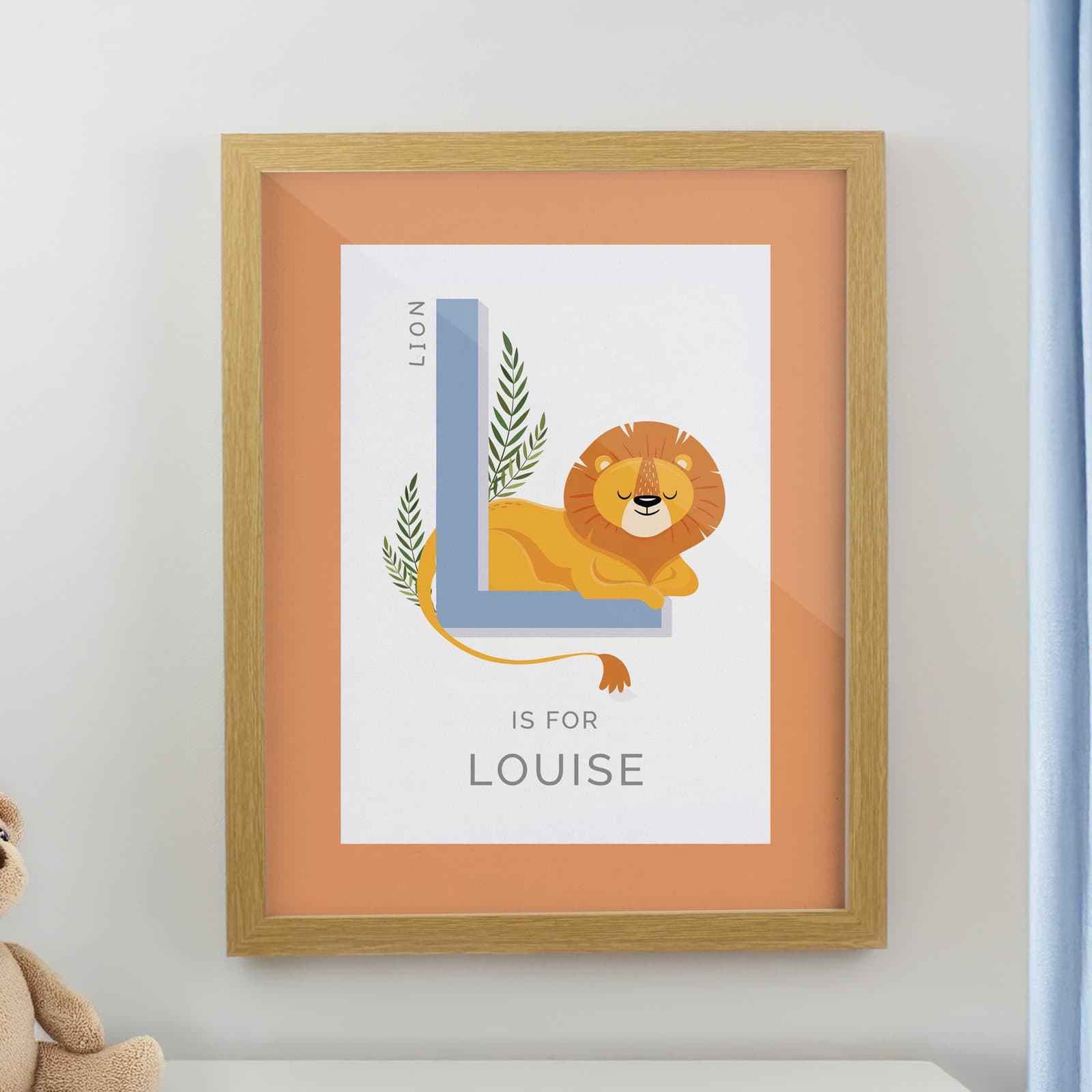 Colourful animal alphabet framed print in an oak frame with initial and name