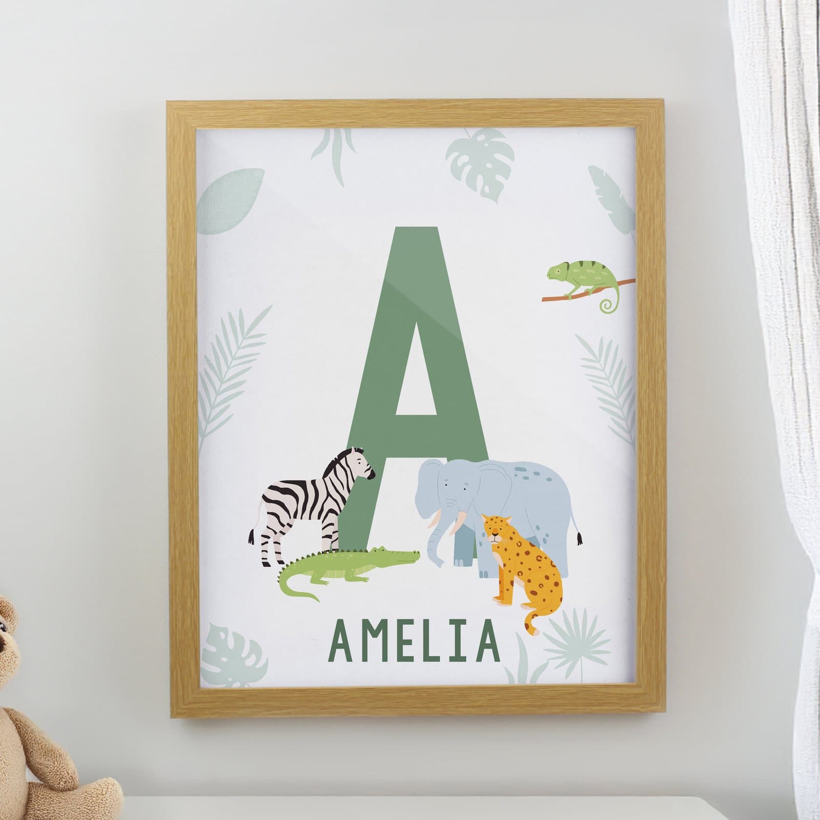 Colourful animal initial framed print in an oak frame