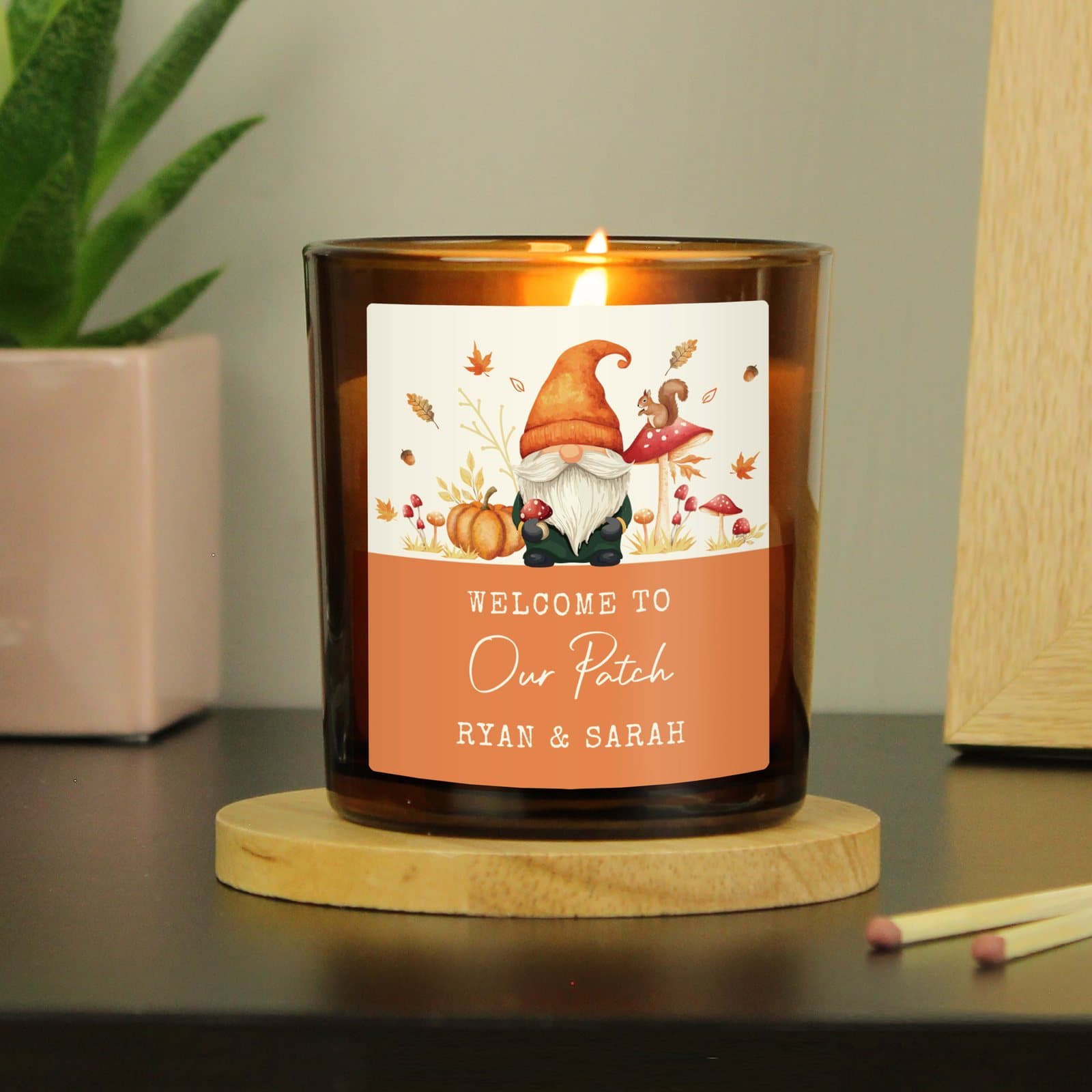 Amber glass candle jar with a personalised label