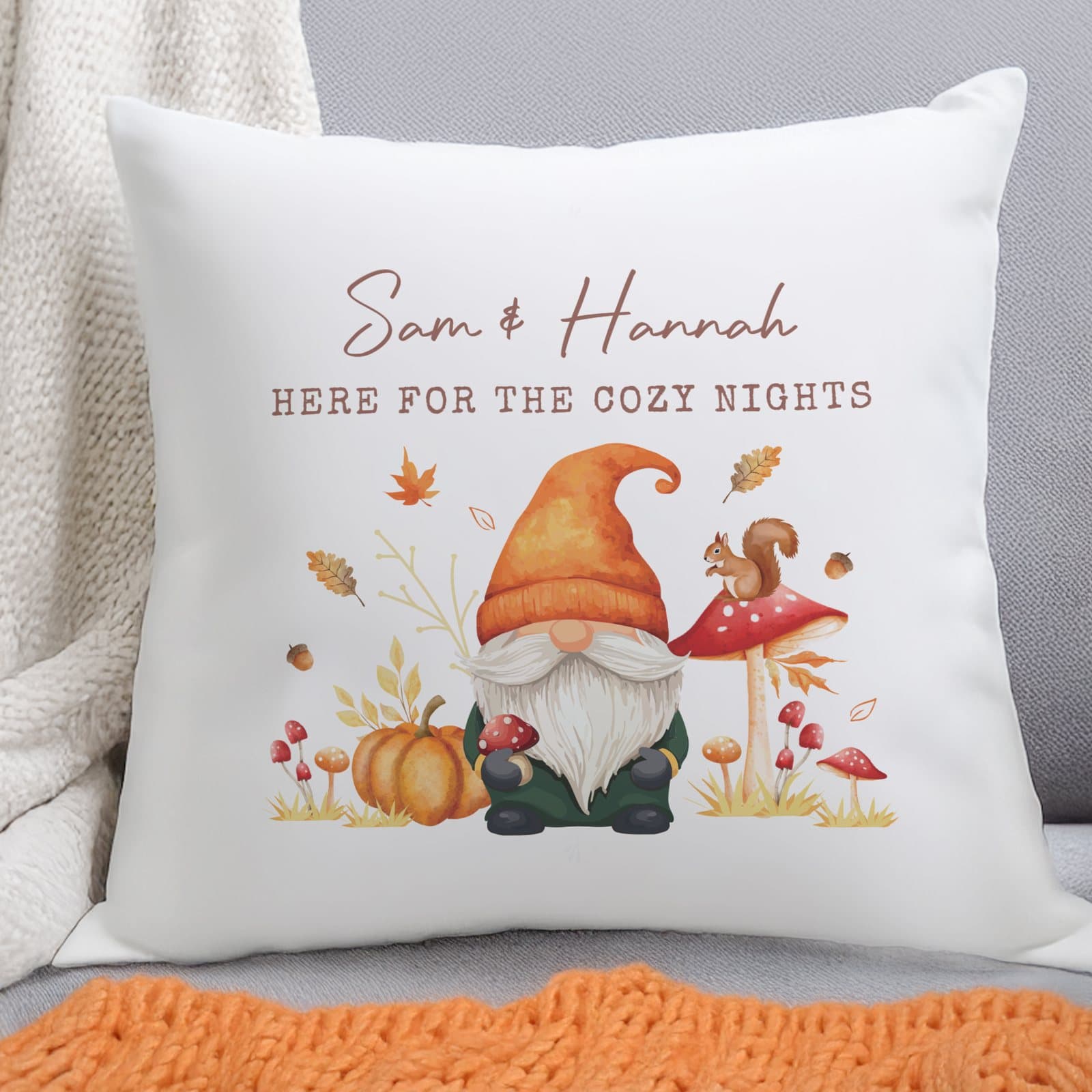 Autumn gonk cushion with a script line and a bold uppercase line of text