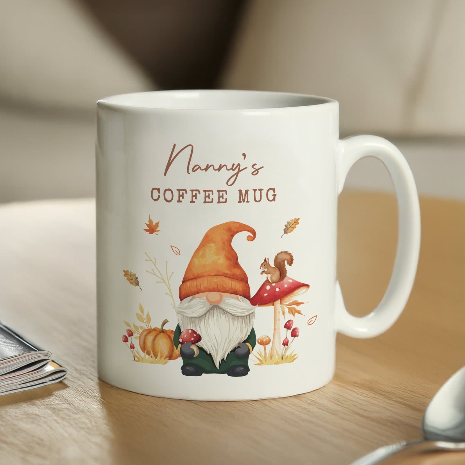 Ceramic autumn mug with a gonk illustration and personalised message lines